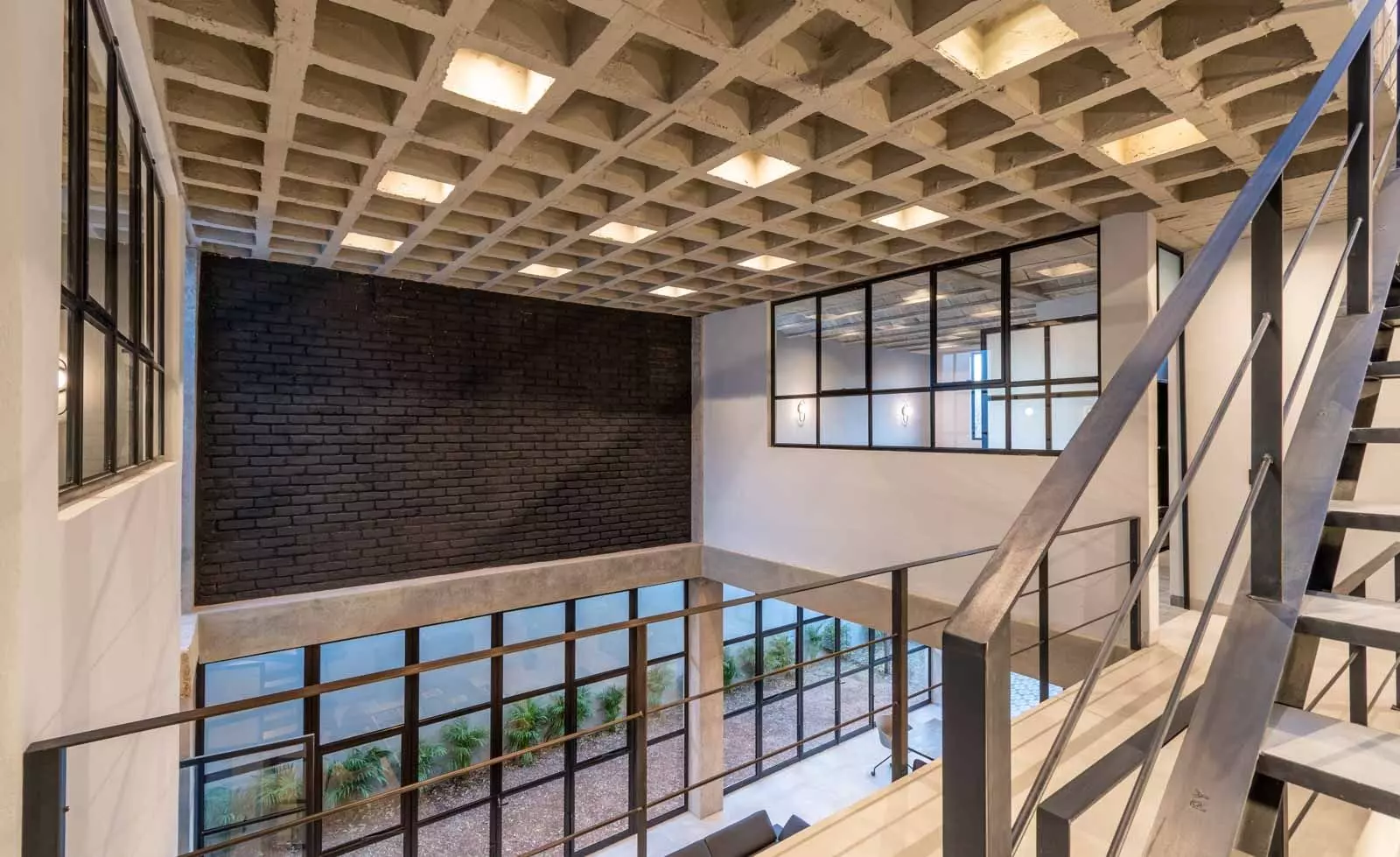 Brut House — San Antonio, San Miguel de Allende — photo 13 — modern mezzanine with abundant natural light