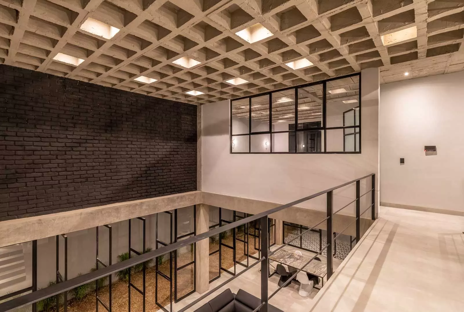 Brut House — San Antonio, San Miguel de Allende — photo 14 — modern mezzanine with soaring skylights