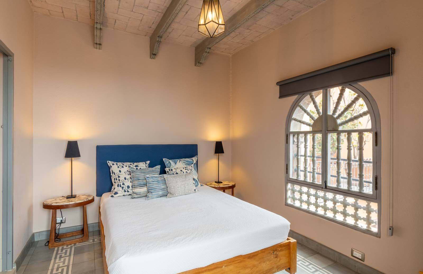 Casa Recreo — Centro, San Miguel de Allende — photo 21 — serene bedroom with luminous arched windows