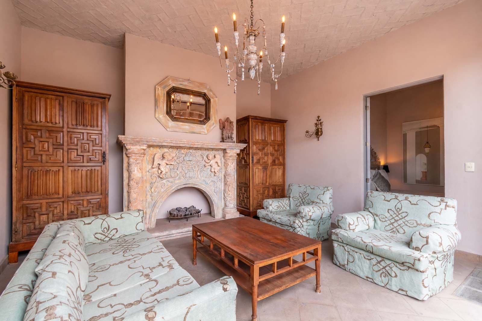 Casa Recreo — Centro, San Miguel de Allende — photo 24 — elegant salon with ornamental fireplace