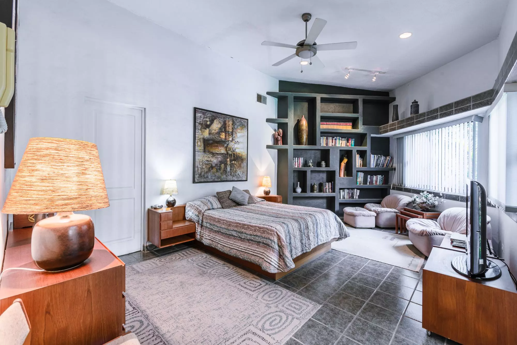 Exquisite Home in Prime San Miguel de Allende Location — Guadiana, San Miguel de Allende — photo 6 — sophisticated master suite with curated collections
