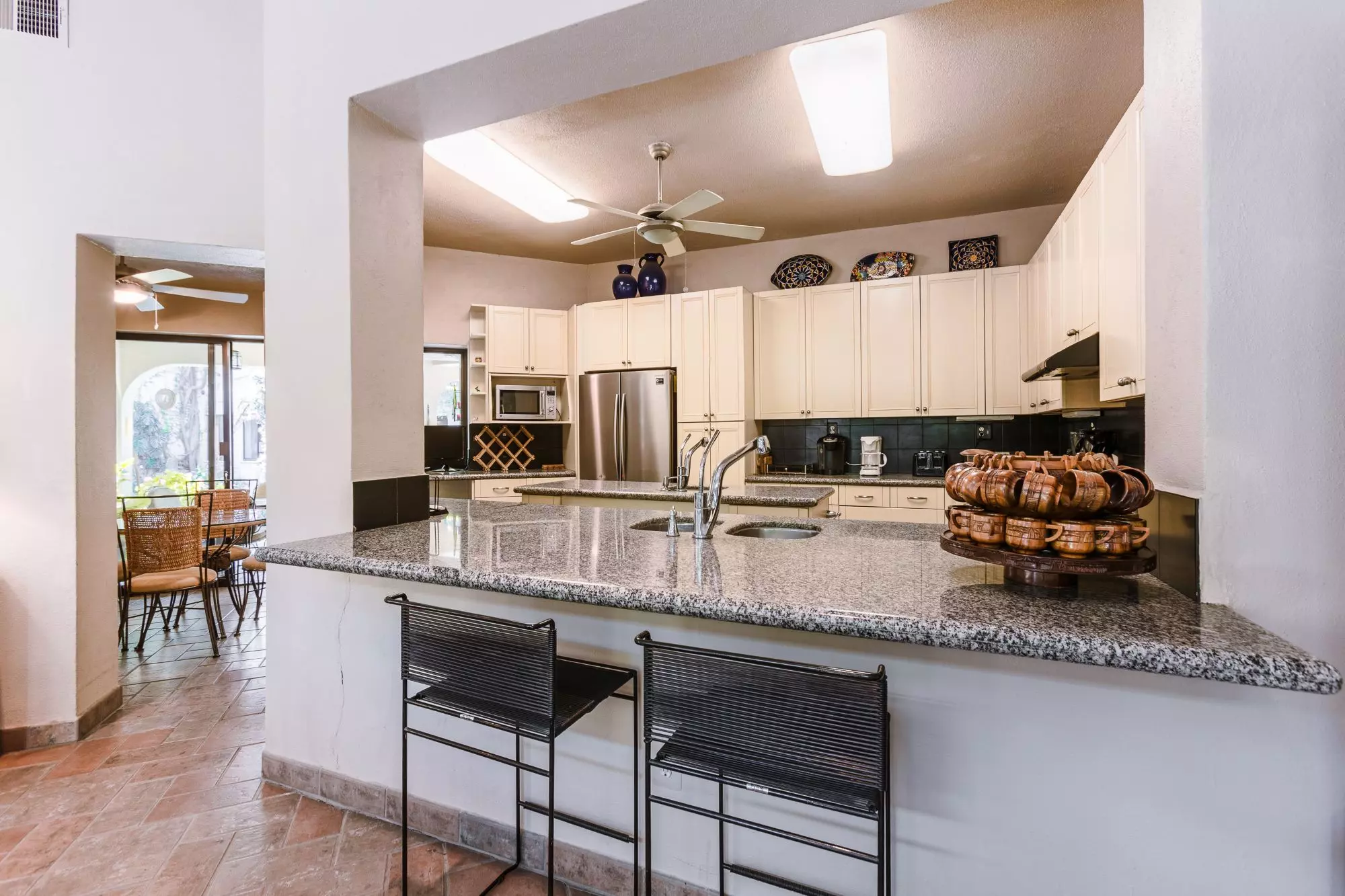 Exquisite Home in Prime San Miguel de Allende Location — Guadiana, San Miguel de Allende — photo 2 — luminous chef's kitchen, granite elegance