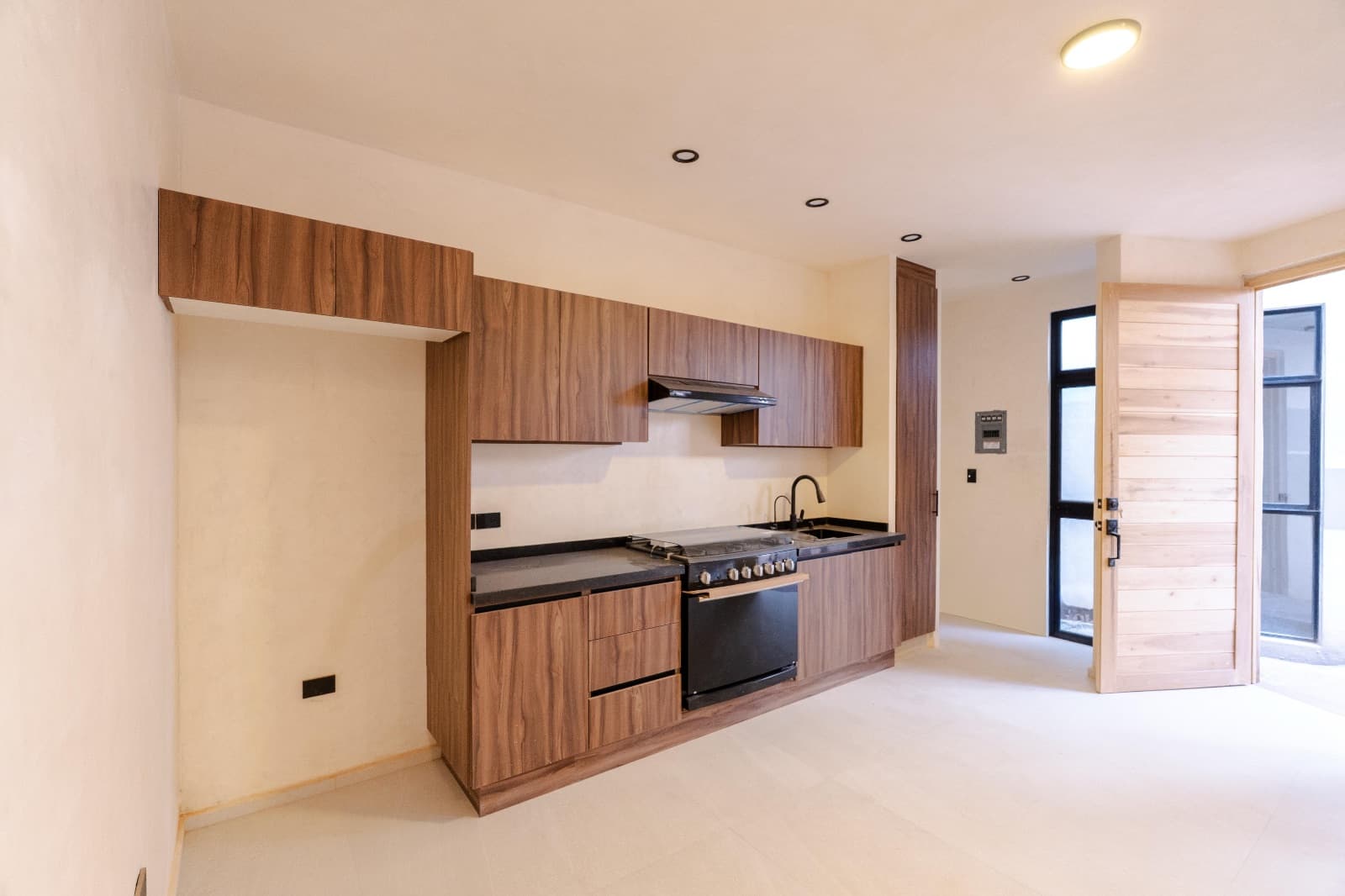 Nuñez Lofts / Loft 2 — Centro, San Miguel de Allende — photo 4 — contemporary kitchen, warm wood cabinetry