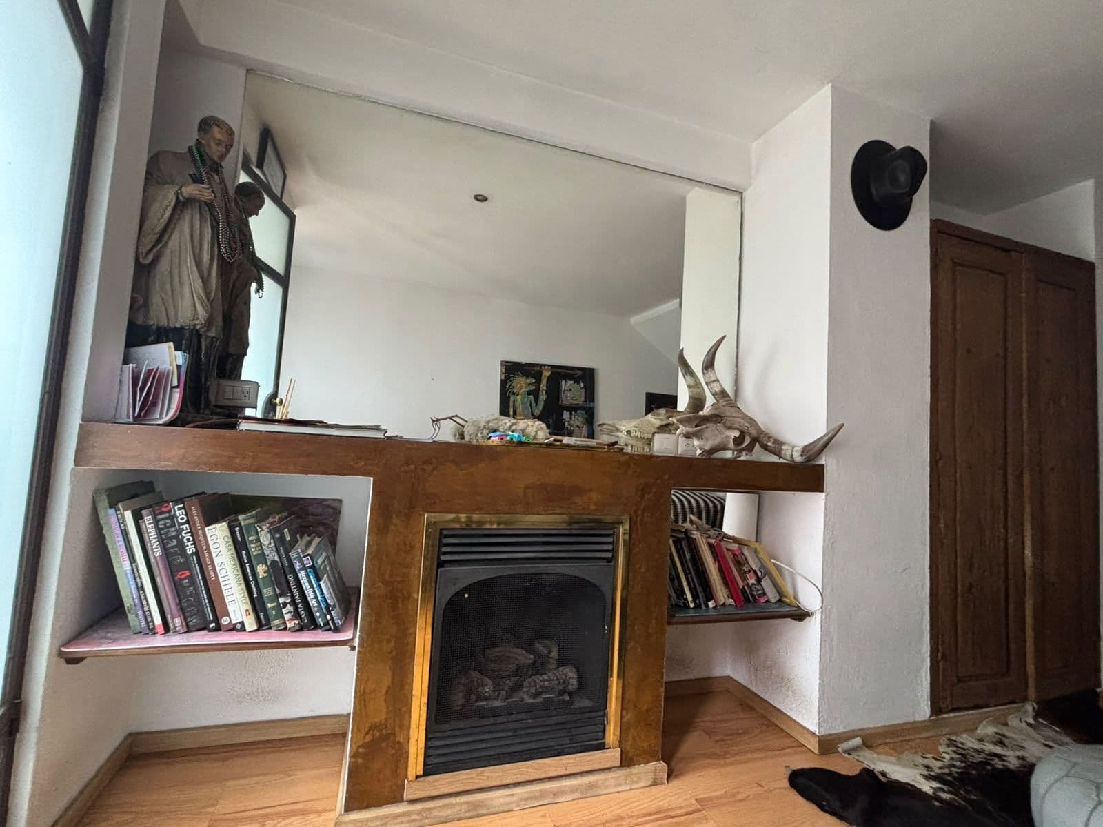 Casita Roja: Cozy and well located!! — San Antonio, San Miguel de Allende — photo 6 — charming fireplace, curated collections displayed