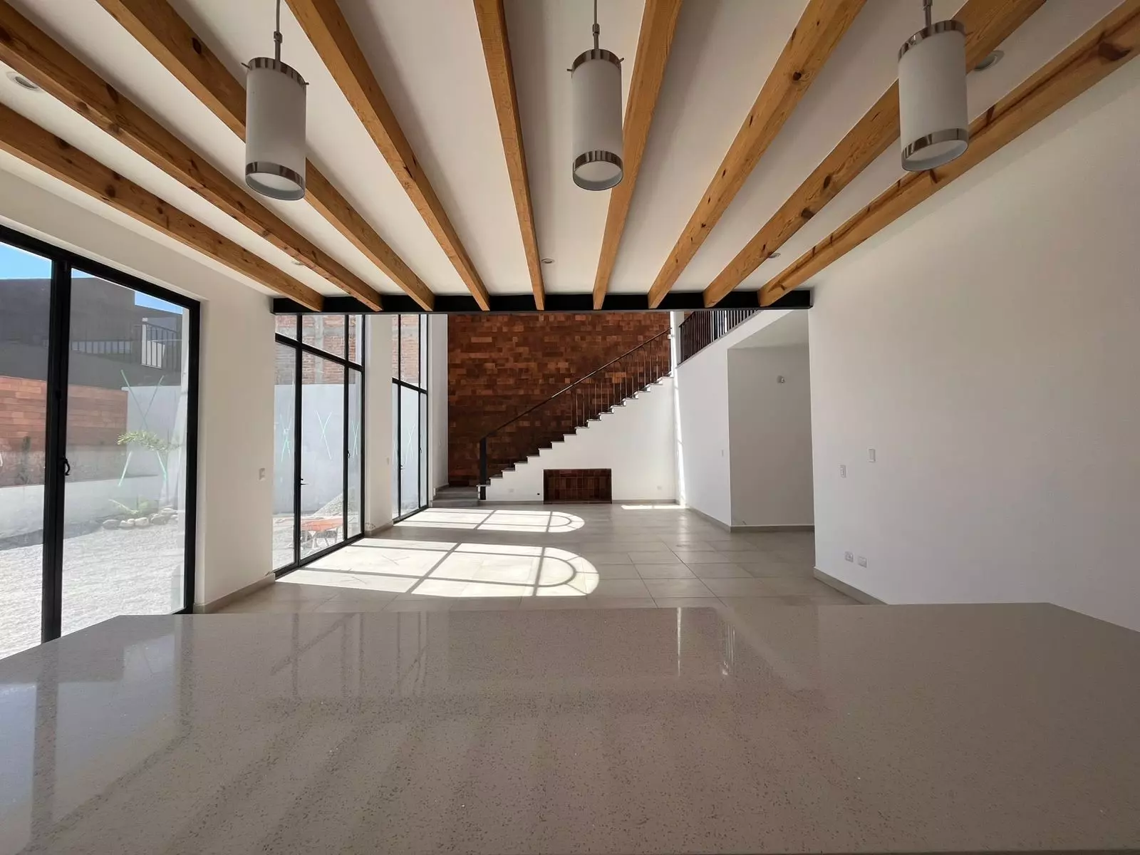CASA LEO — Residencial Malanquin la Mesa, San Miguel de Allende — photo 2 — soaring beams, luminous open-concept living
