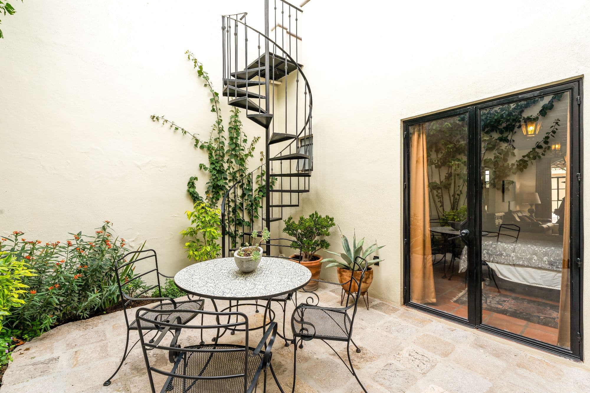 Casa Sombremesa — Las Brisas, San Miguel de Allende — photo 9 — charming courtyard with spiral staircase