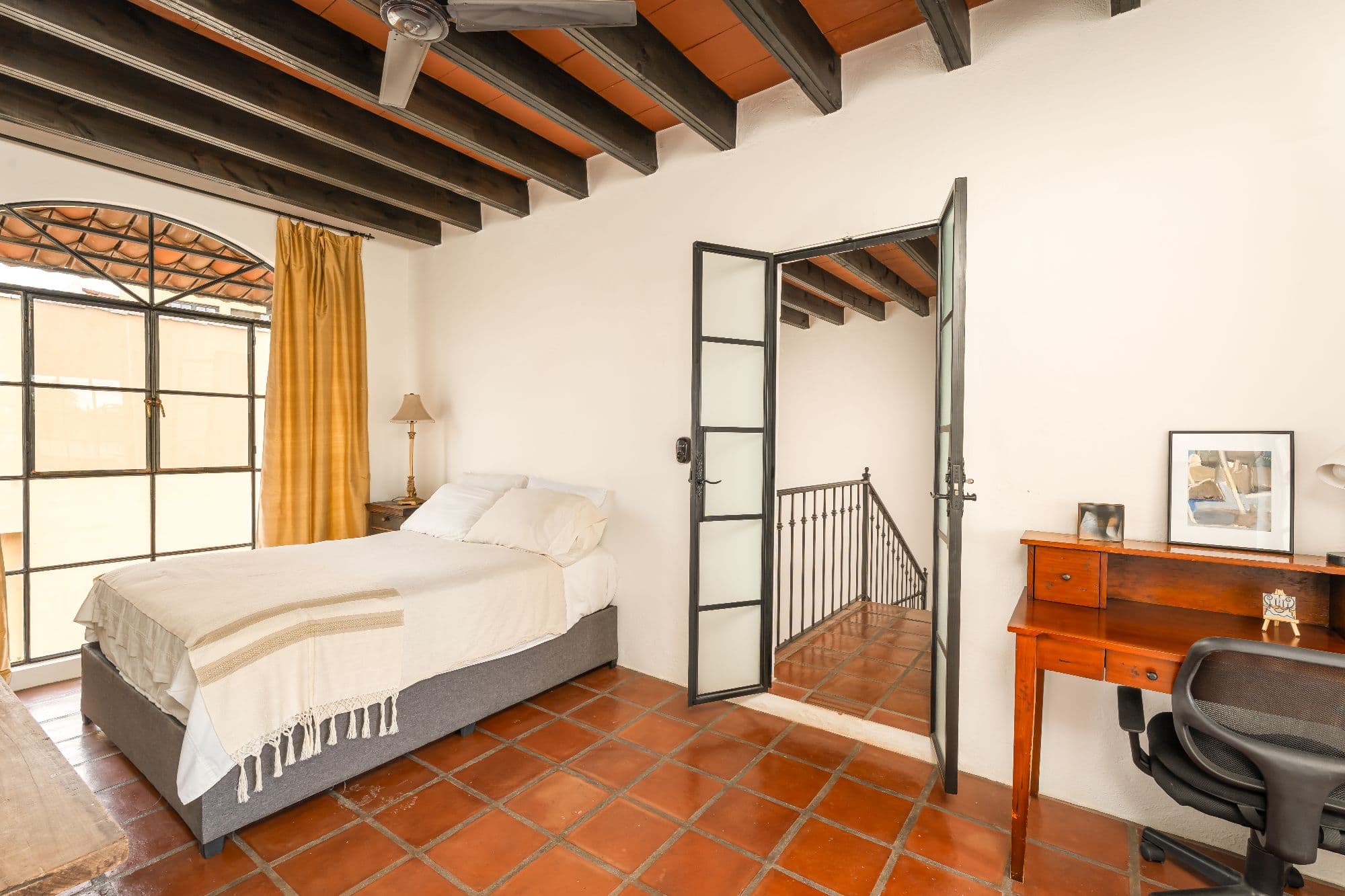 Casa Sombremesa — Las Brisas, San Miguel de Allende — photo 21 — sunlit bedroom, rustic beams, authentic charm