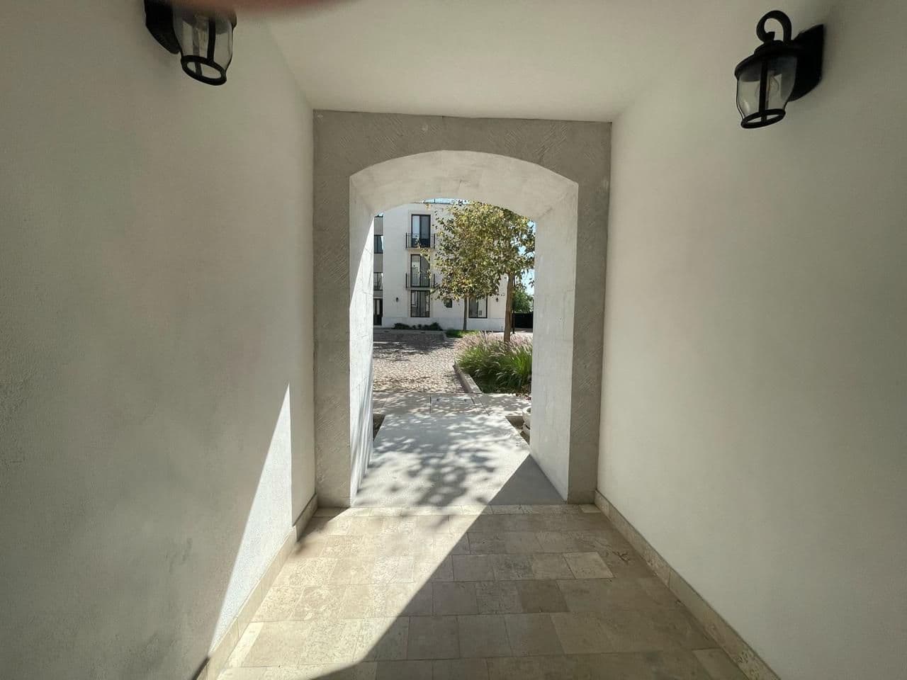 Casa Daniel Residencial La Luminaria — Atascadero (Arcos de San Miguel), San Miguel de Allende — photo 11 — elegant arched passage, courtyard views