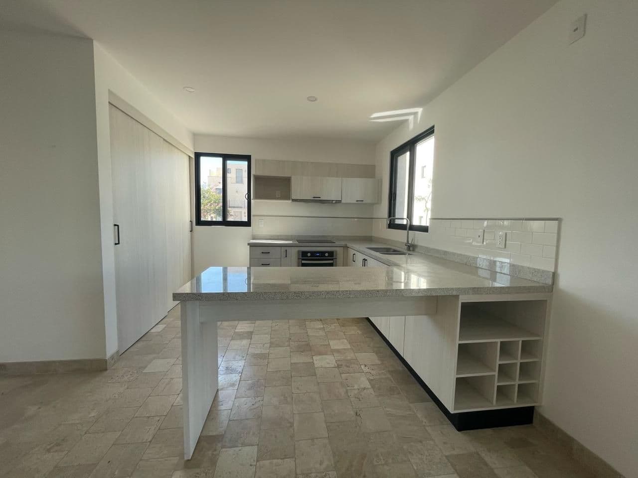 Casa Daniel Residencial La Luminaria — Atascadero (Arcos de San Miguel), San Miguel de Allende — photo 5 — bright modern kitchen with island charm