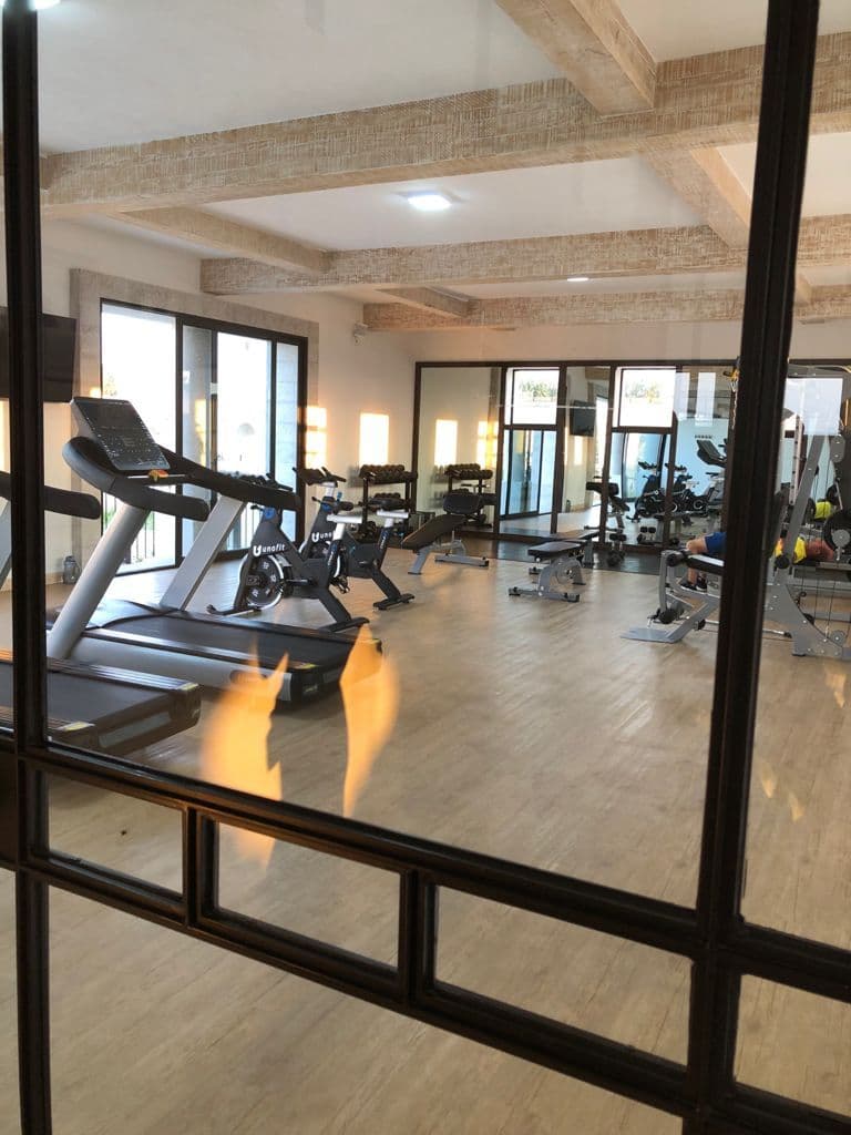 Casa Daniel Residencial La Luminaria — Atascadero (Arcos de San Miguel), San Miguel de Allende — photo 19 — modern fitness sanctuary with soaring beams