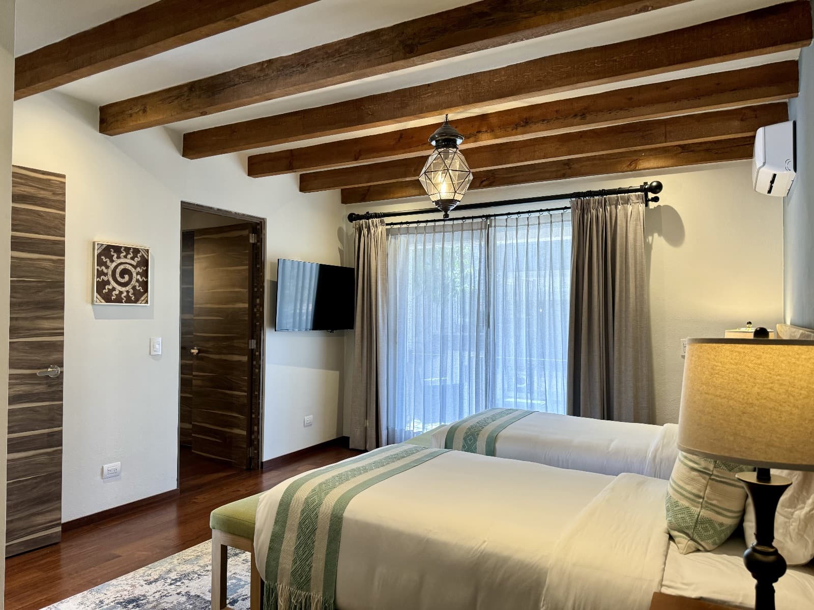 Quinta Tenerías (Units 2, 4 & 5) — Centro, San Miguel de Allende — photo 21 — rustic-elegant master suite with architectural beams