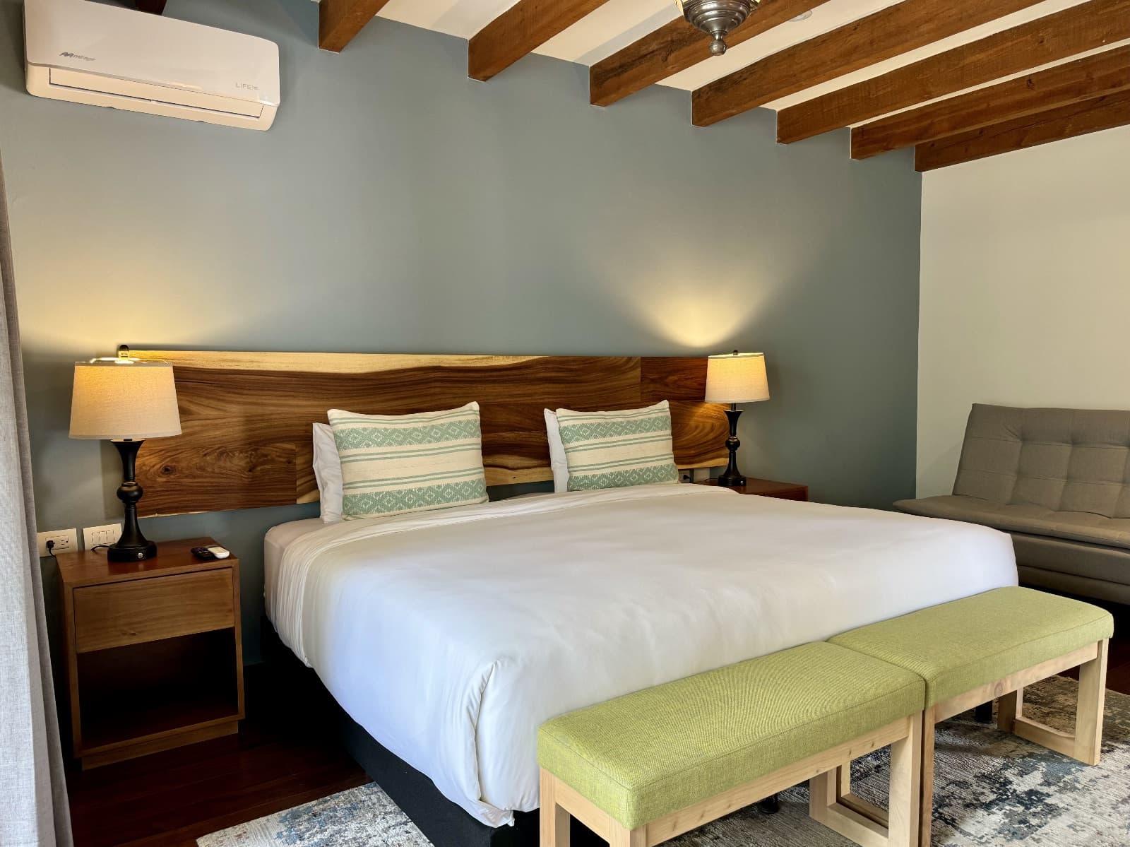 Quinta Tenerías (Units 2, 4 & 5) — Centro, San Miguel de Allende — photo 12 — serene bedroom with exposed beams, natural light