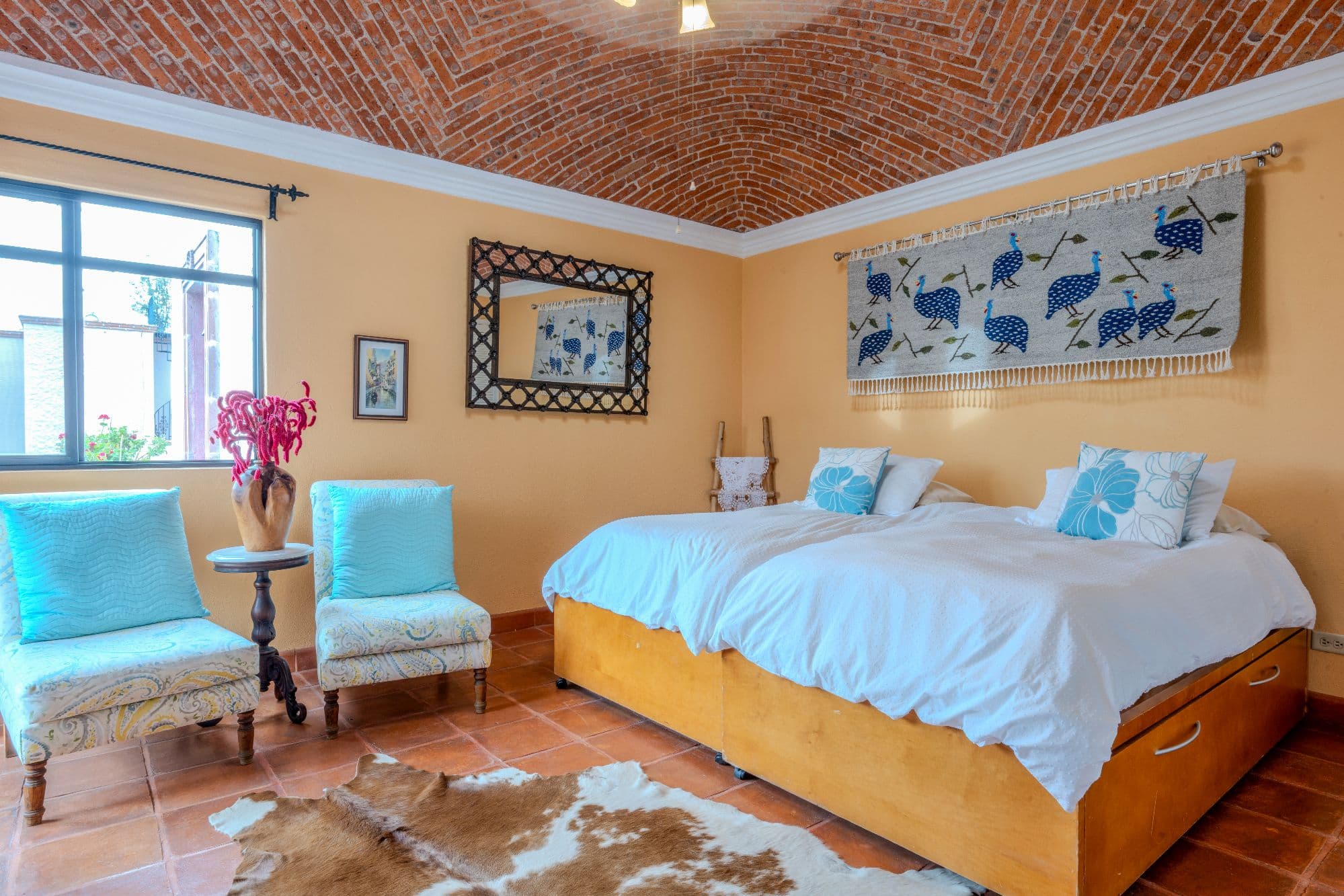 Casa De Las Máscaras — Atascadero (Arcos de San Miguel), San Miguel de Allende — photo 25 — sunlit bedroom with rustic charm