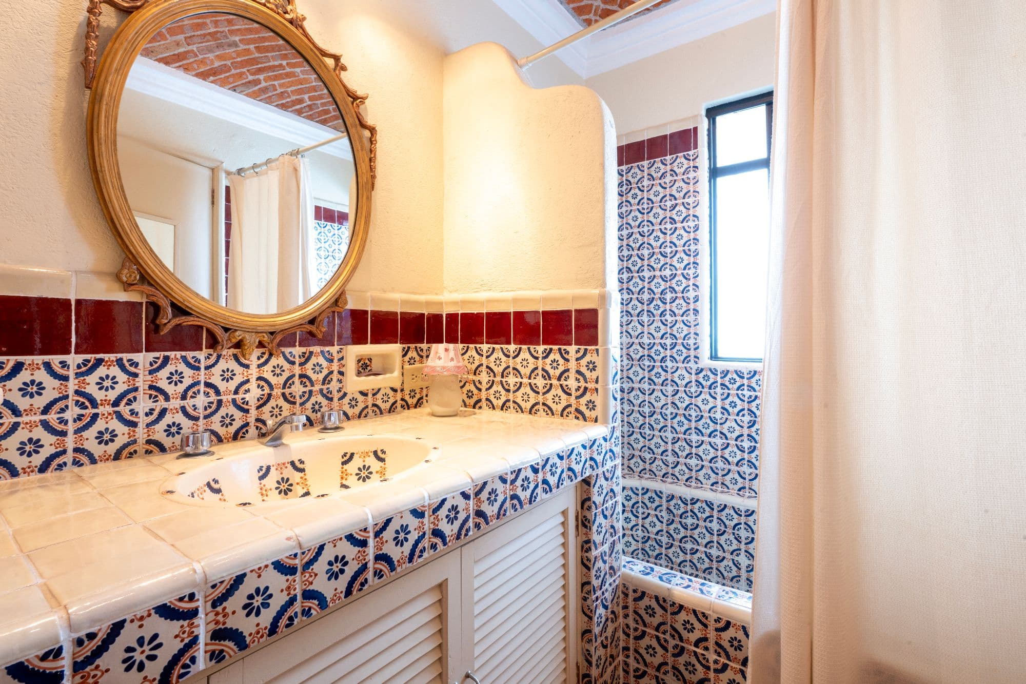Casa De Las Máscaras — Atascadero (Arcos de San Miguel), San Miguel de Allende — photo 26 — artisan-tiled, sun-drenched bathroom sanctuary