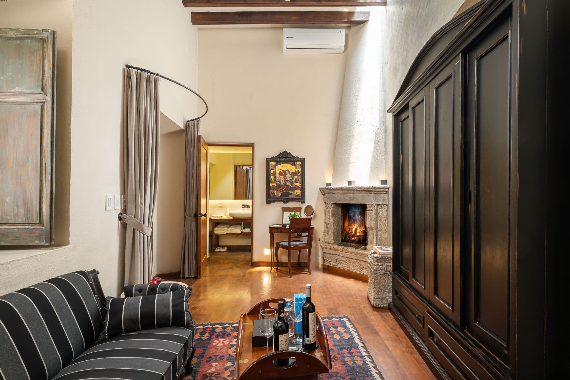 Casa No Name — Centro, San Miguel de Allende — photo 42 — elegant fireplace suite, soaring ceilings