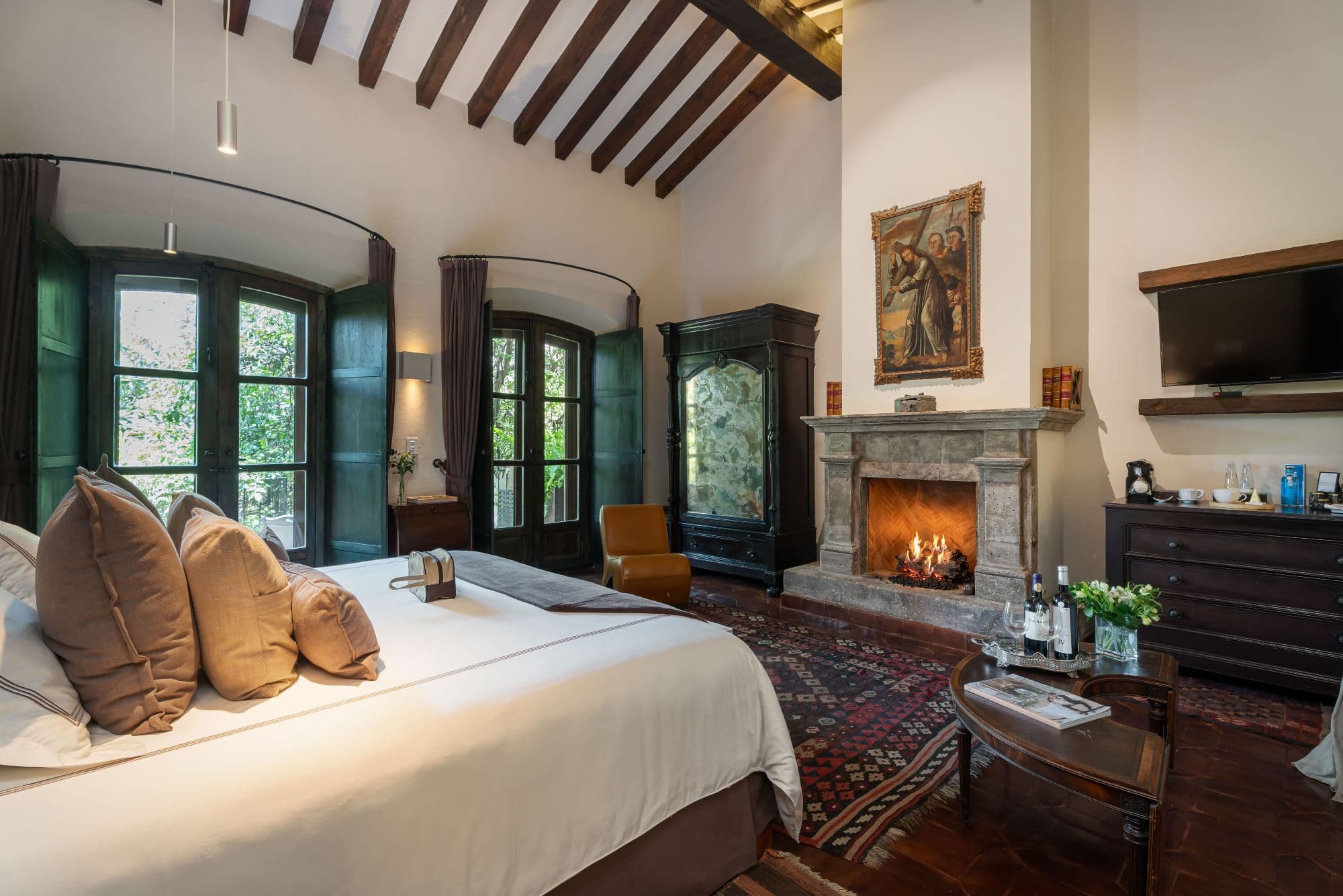 Casa No Name — Centro, San Miguel de Allende — photo 34 — luxurious colonial bedroom with fireplace