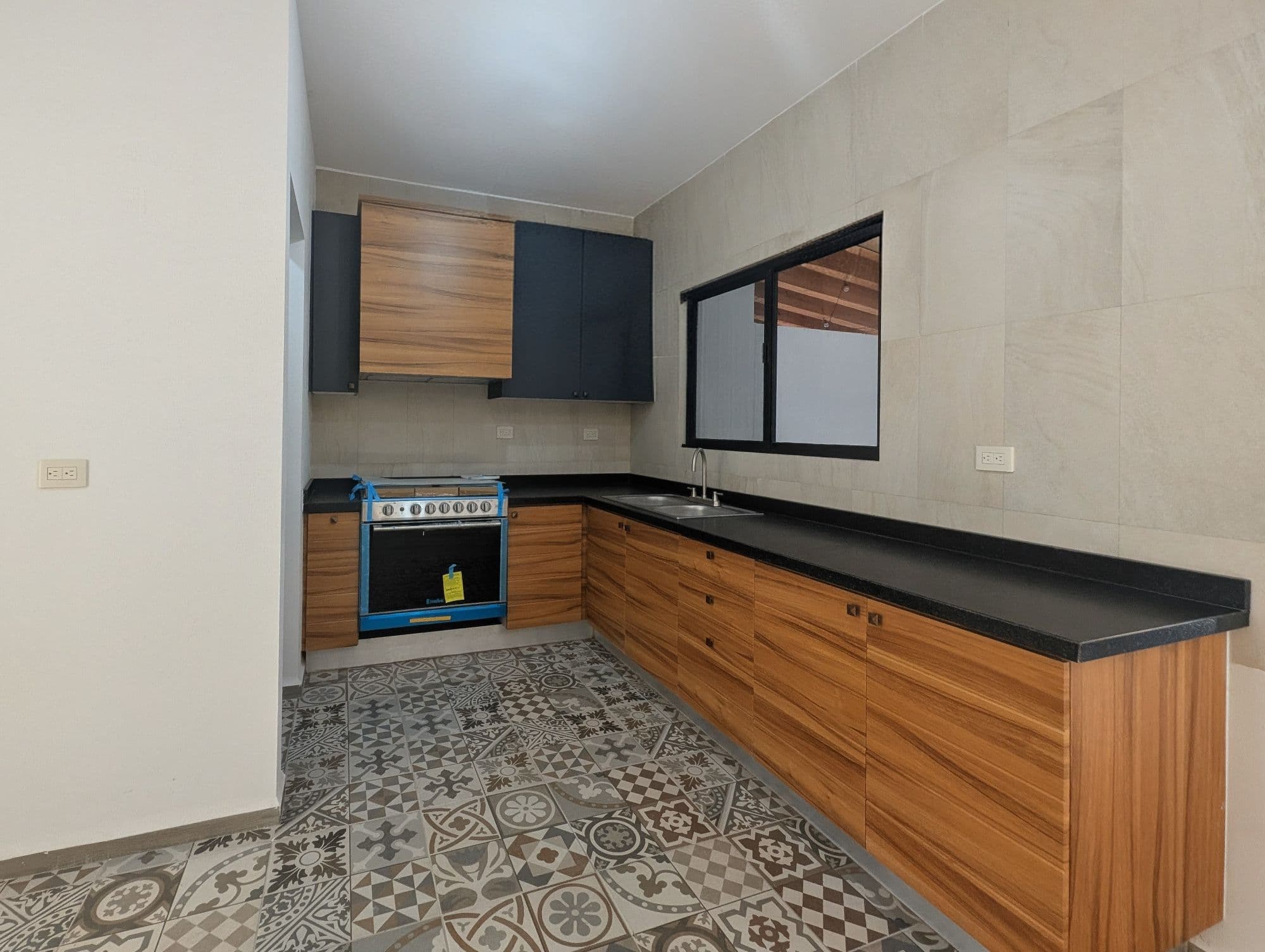 Casa Arcángel — Villa de los Frailes, San Miguel de Allende — photo 3 — contemporary kitchen with artisan tile flooring