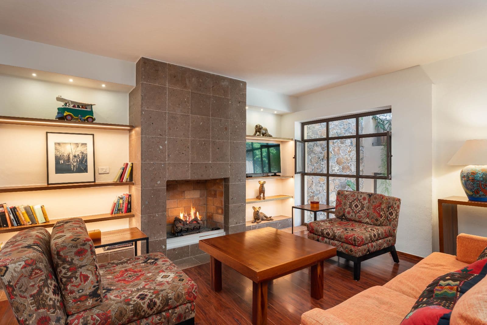 Casa 28 — Centro, San Miguel de Allende — photo 9 — sophisticated living with architectural fireplace