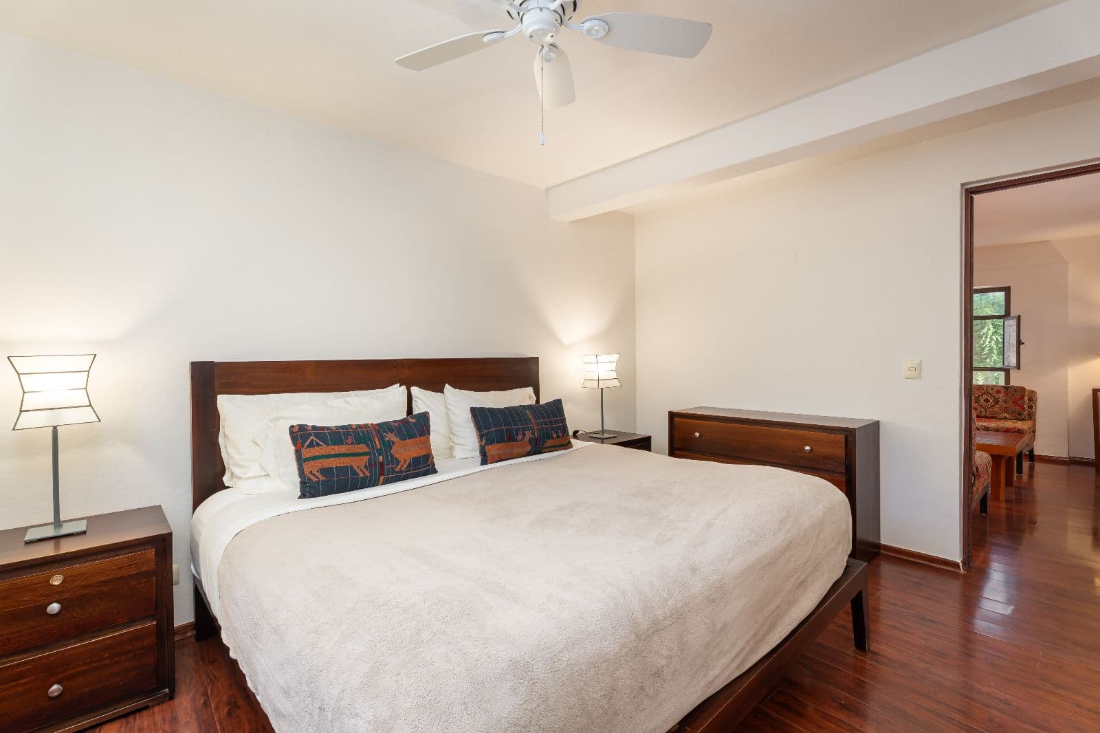 Casa 28 — Centro, San Miguel de Allende — photo 20 — serene master suite, warm wood elegance