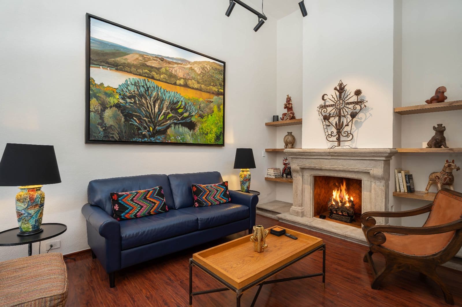 Casa 28 — Centro, San Miguel de Allende — photo 6 — sophisticated living with fireplace warmth