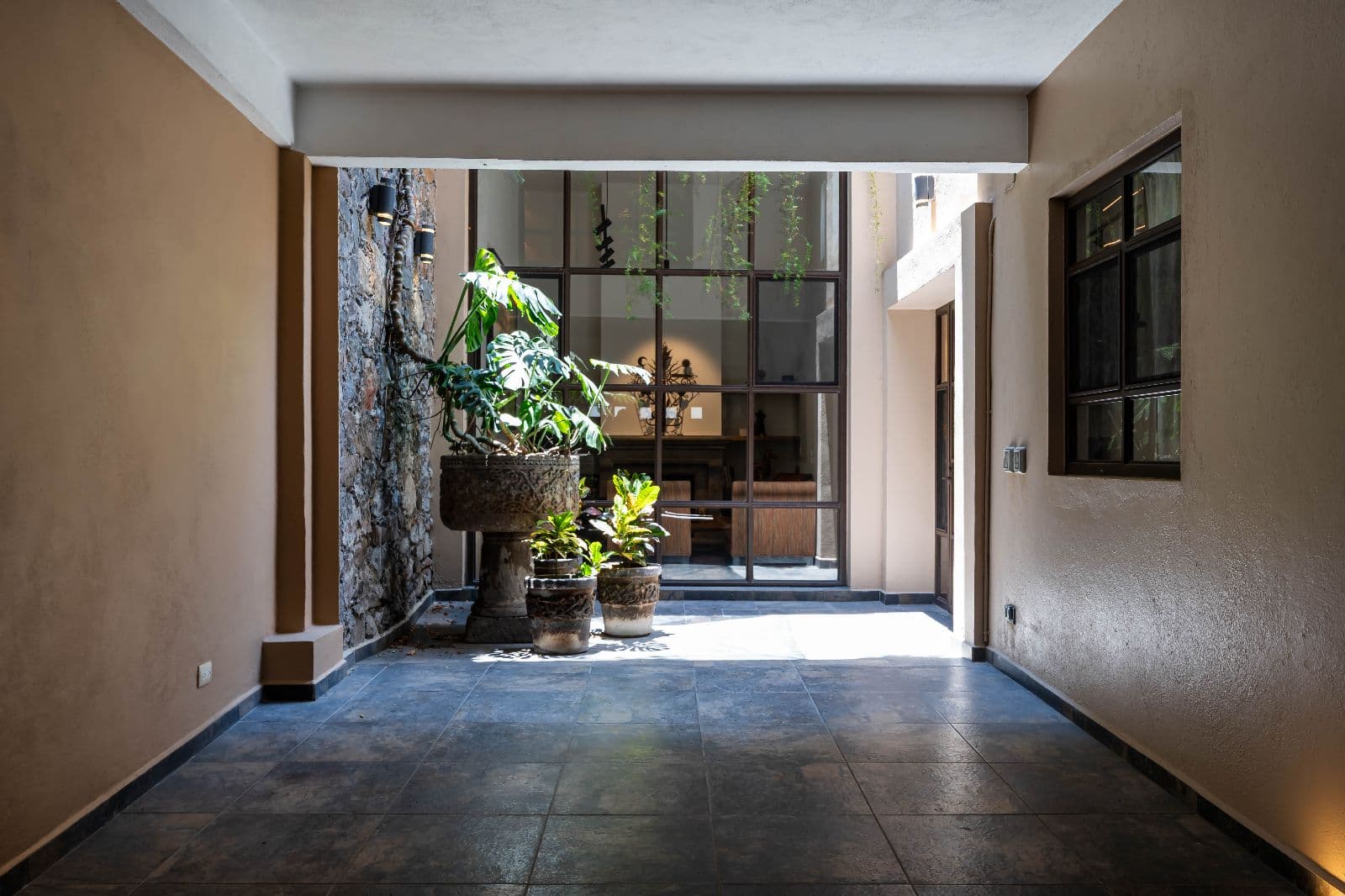 Casa 28 — Centro, San Miguel de Allende — photo 25 — luminous courtyard with verdant gardens