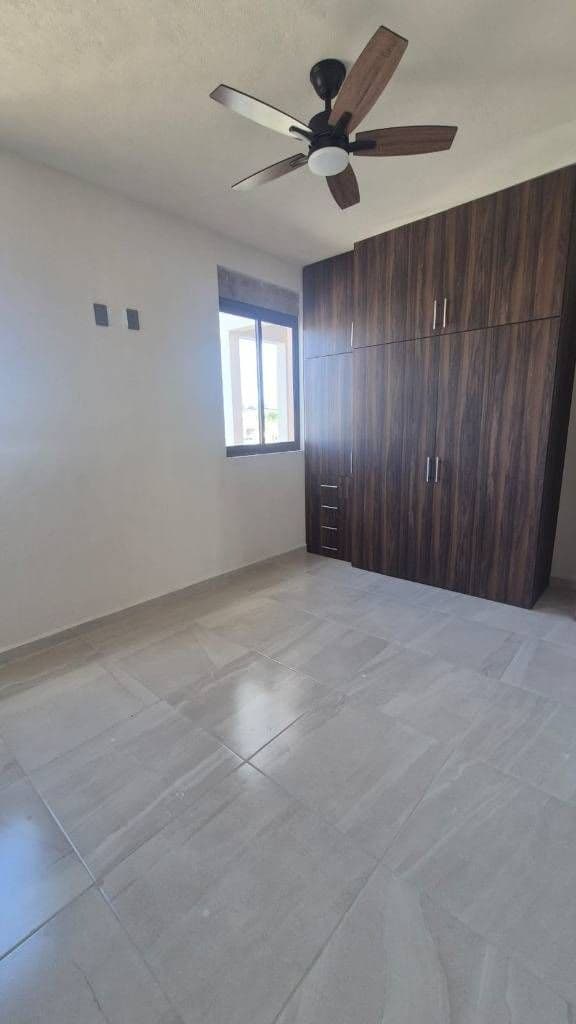 Departamento Lavanda — Zirándaro, San Miguel de Allende — photo 5 — serene bedroom with refined wood cabinetry