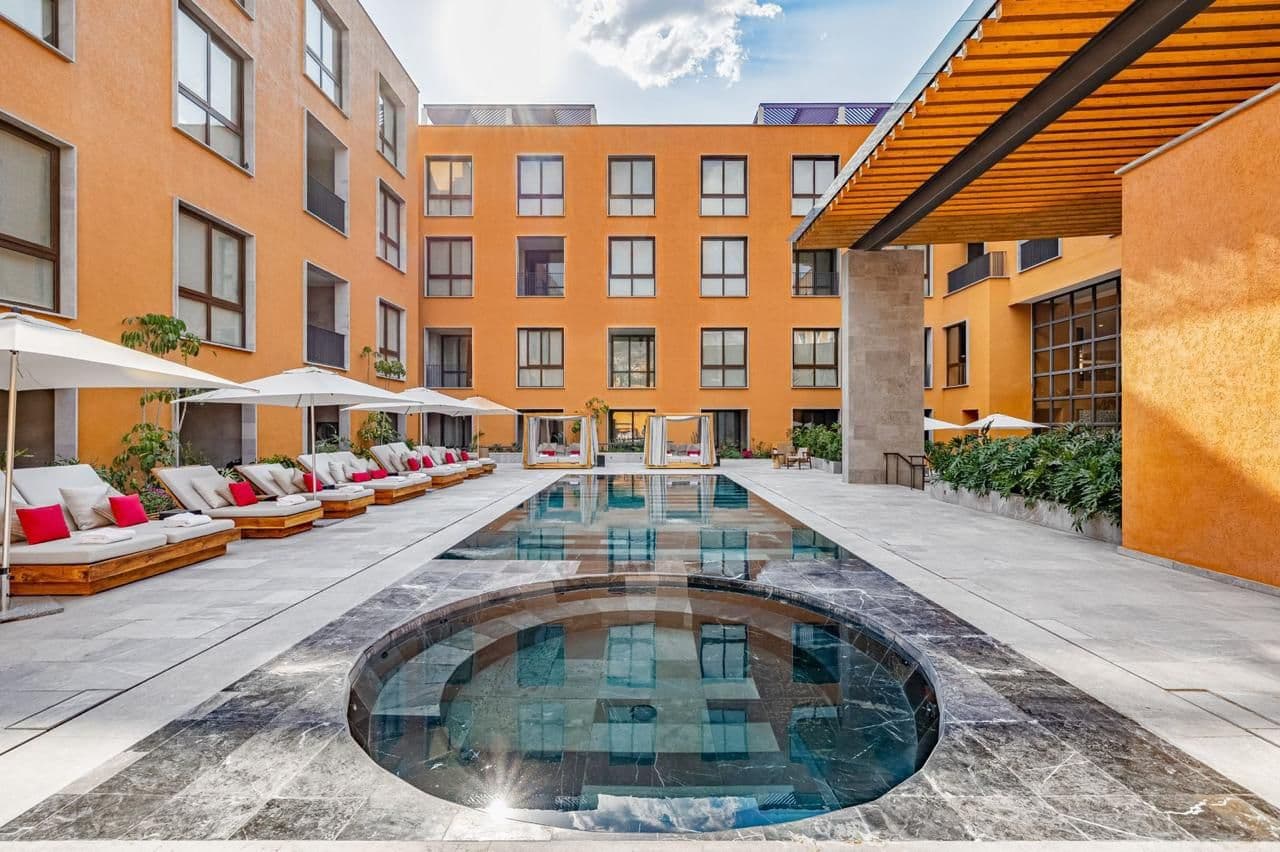 Clevia Apartment — Centro, San Miguel de Allende — photo 6 — sophisticated courtyard with resort-style pool