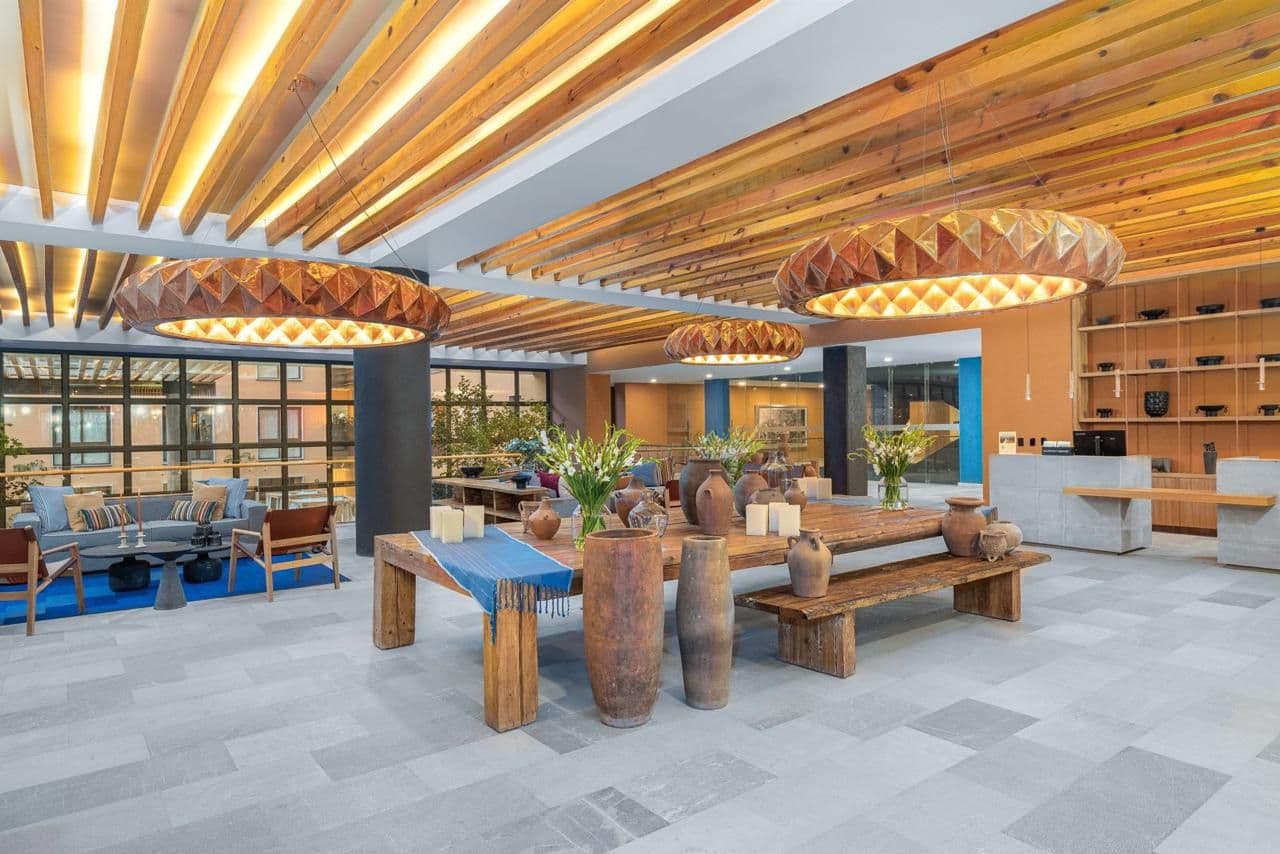 Clevia Apartment — Centro, San Miguel de Allende — photo 3 — contemporary luxury lobby with architectural warmth