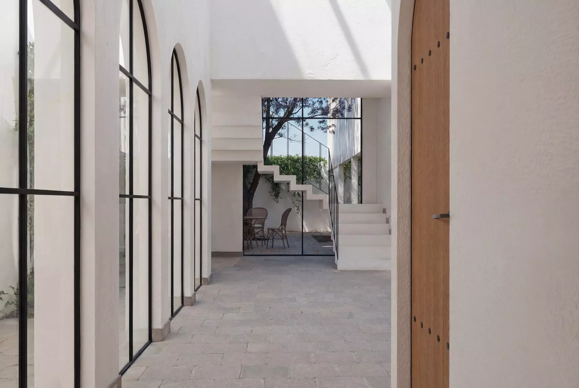 ALVA Lot 6 — El Obraje, San Miguel de Allende — photo 13 — serene colonnade with radiant natural light