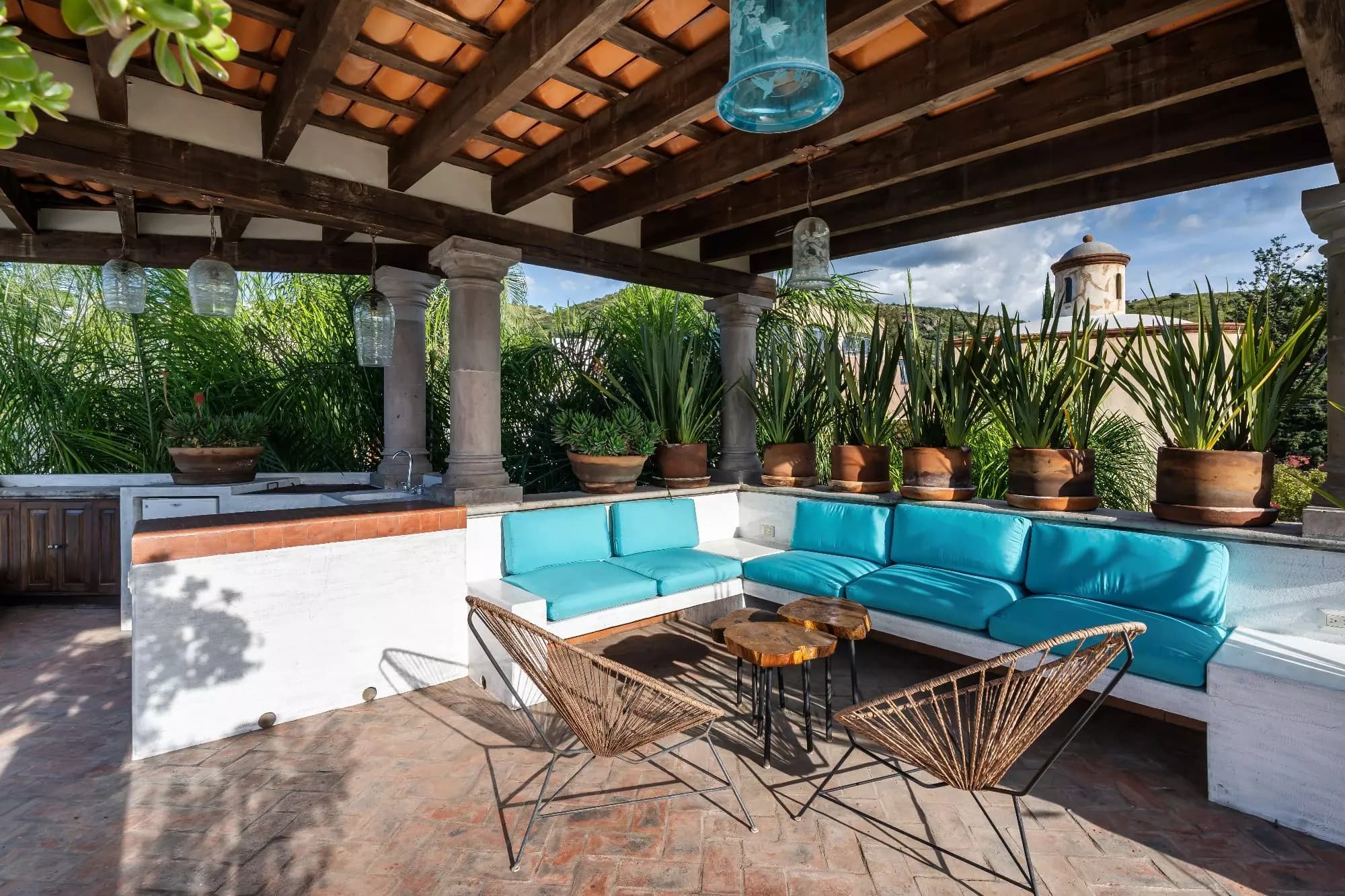 Casa Dos Casas — Guadiana, San Miguel de Allende — photo 16 — luxurious covered terrace with turquoise seating