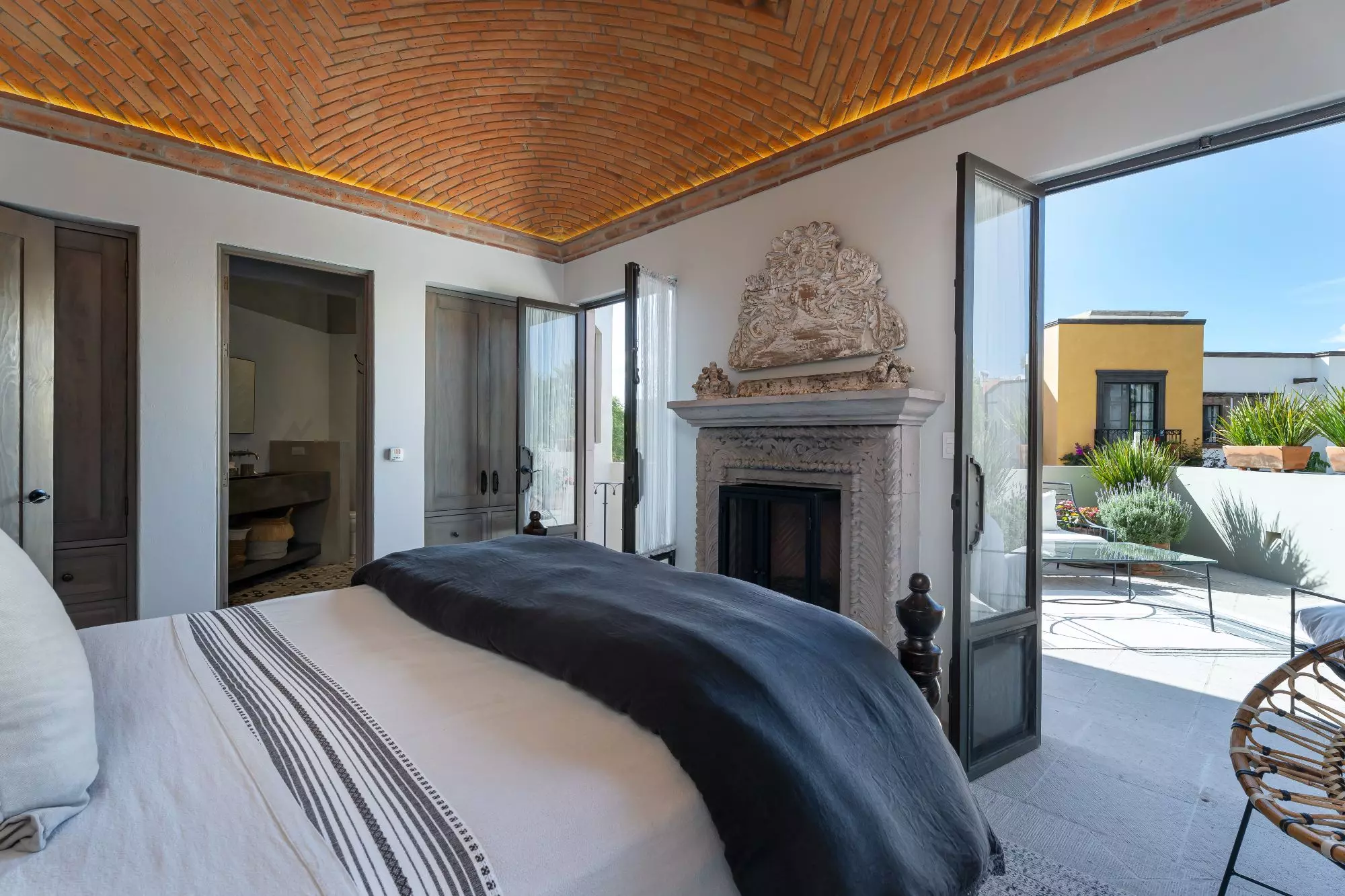 Casa Dos Casas — Guadiana, San Miguel de Allende — photo 35 — sophisticated bedroom with terracotta ceiling details