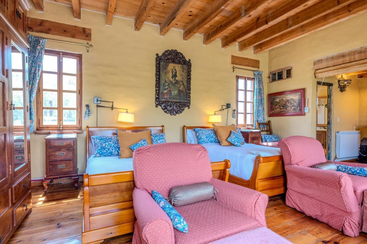 Campo Azul — San Miguel de Allende Centro, San Miguel de Allende — photo 6 — sunlit colonial bedroom, rustic timber elegance