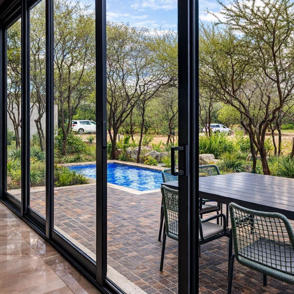 Modern Luxury Home with Casita & Pool in Los Senderos — Los Senderos, Valle de los, San Miguel de Allende — photo 7 — serene poolside living, framed elegance