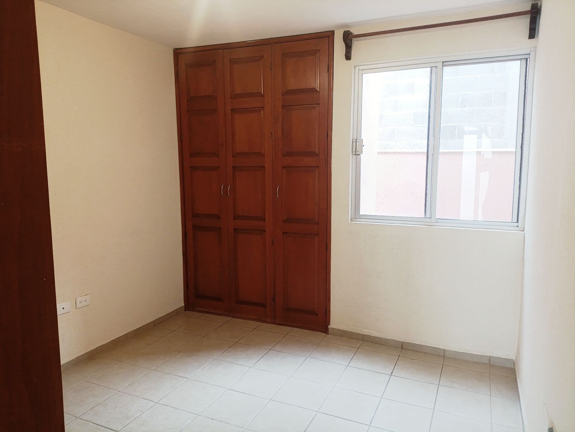Casa Sauz — Las Brisas, San Miguel de Allende — photo 8 — luminous bedroom, charming wooden wardrobe