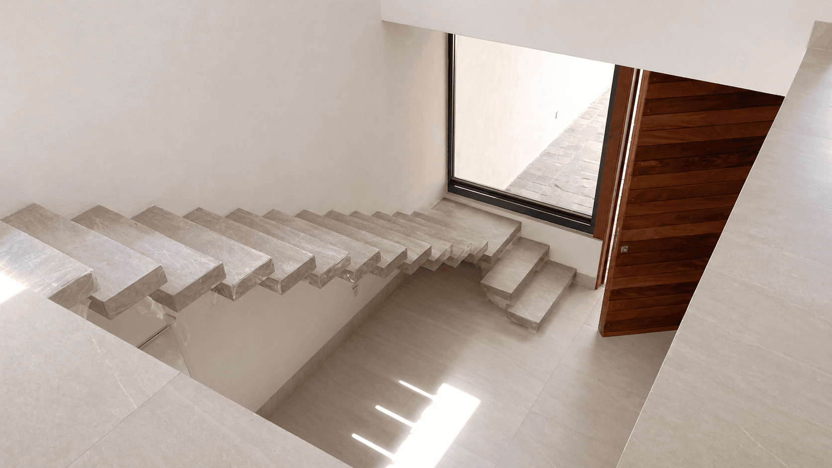 Casa Conspiración 2 — Valle del Maíz, San Miguel de Allende — photo 9 — sunlit staircase, architectural elegance awaits