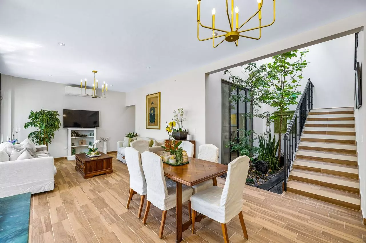 Casa Angel — La Lejona, San Miguel de Allende — photo 10 — sophisticated open-plan living with verdant courtyard