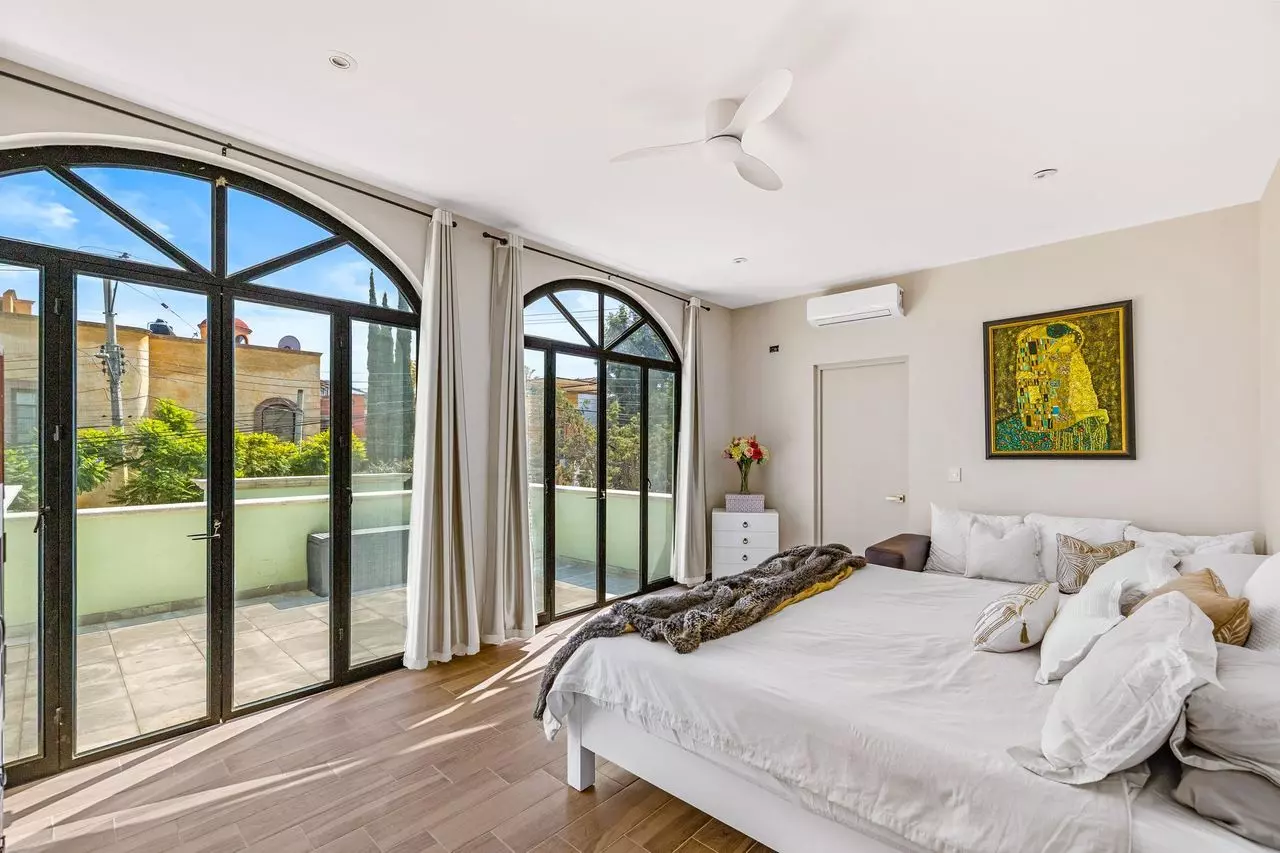 Casa Angel — La Lejona, San Miguel de Allende — photo 19 — sunlit master suite with terrace views