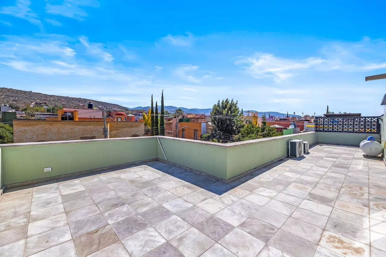 Casa Angel — La Lejona, San Miguel de Allende — photo 26 — expansive rooftop terrace with panoramic mountain views