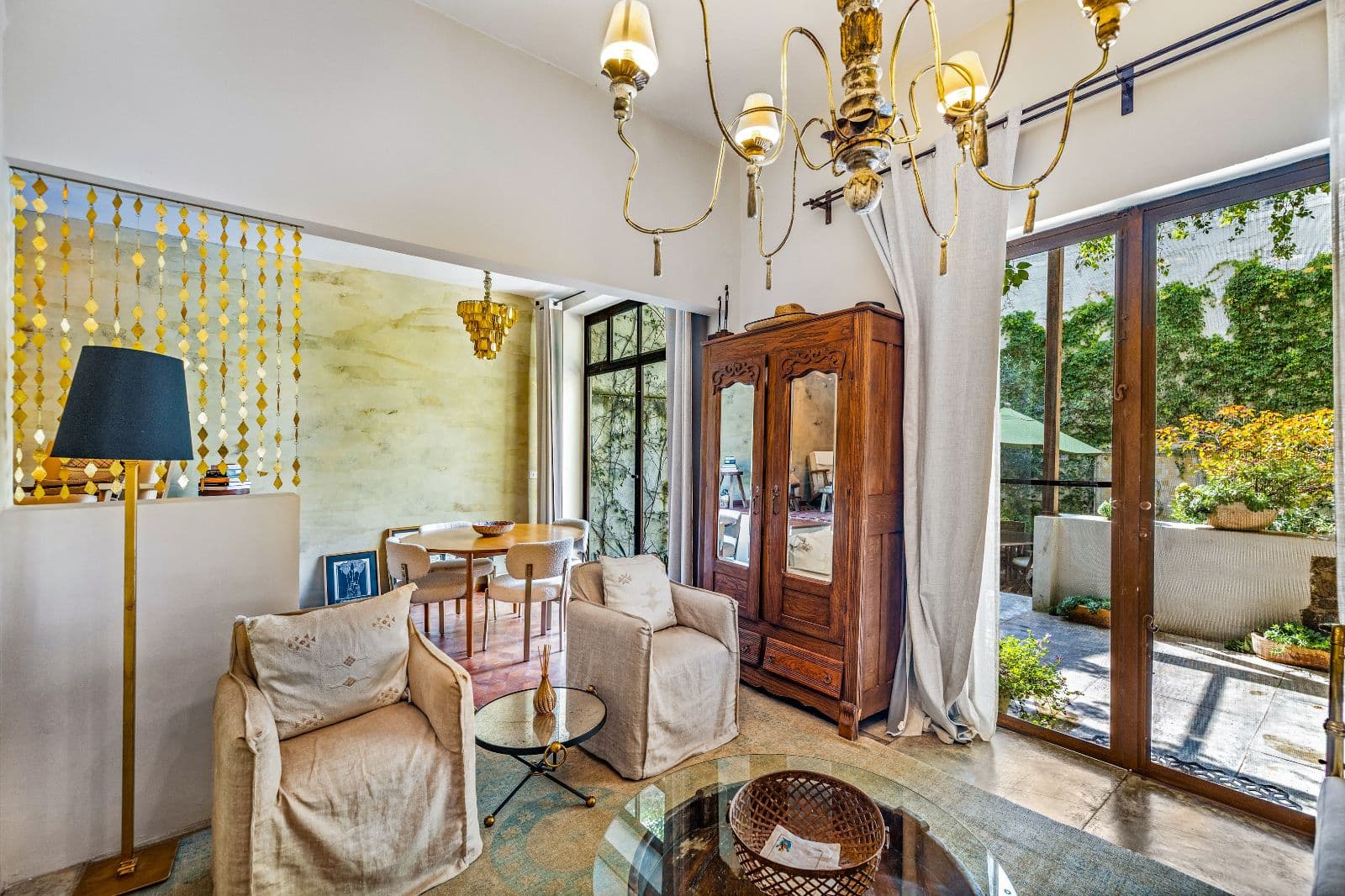 Casa Entresueño — Centro, San Miguel de Allende — photo 13 — luminous salon with verdant courtyard views