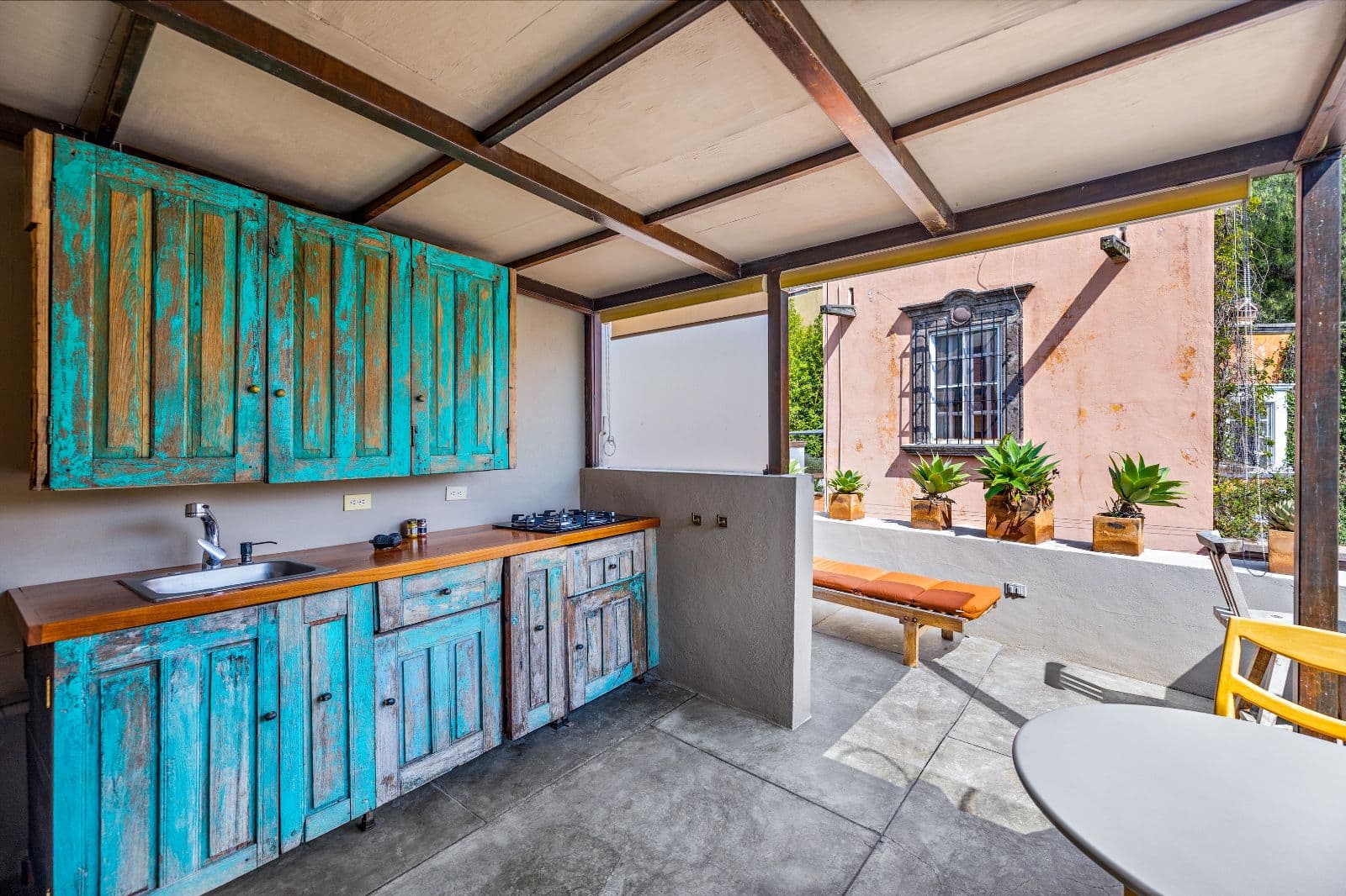 Casa Entresueño — Centro, San Miguel de Allende — photo 24 — rustic turquoise kitchen with courtyard views