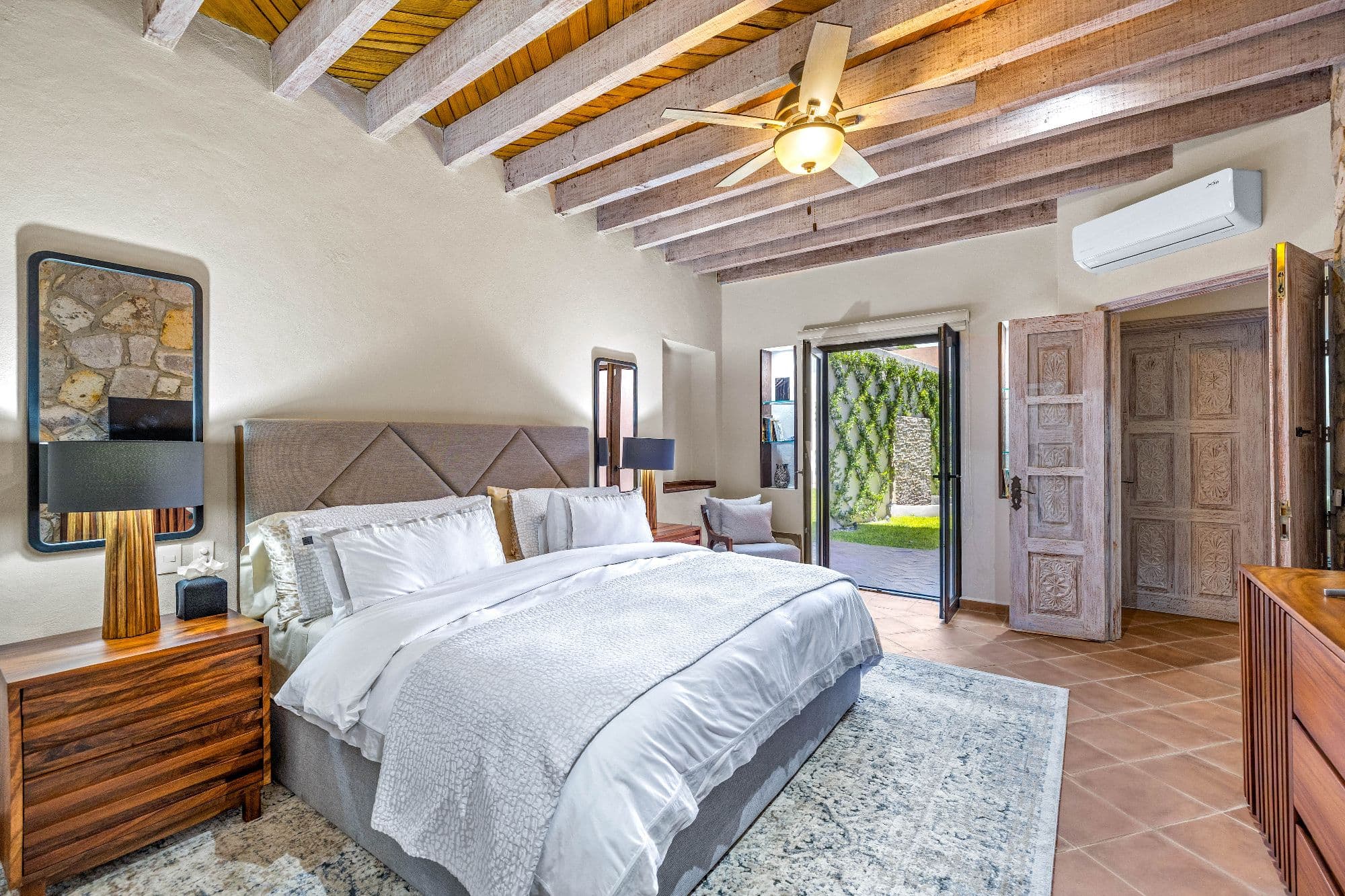Casa de Gracias — Centro, San Miguel de Allende — photo 6 — serene master suite, exposed beams, garden views