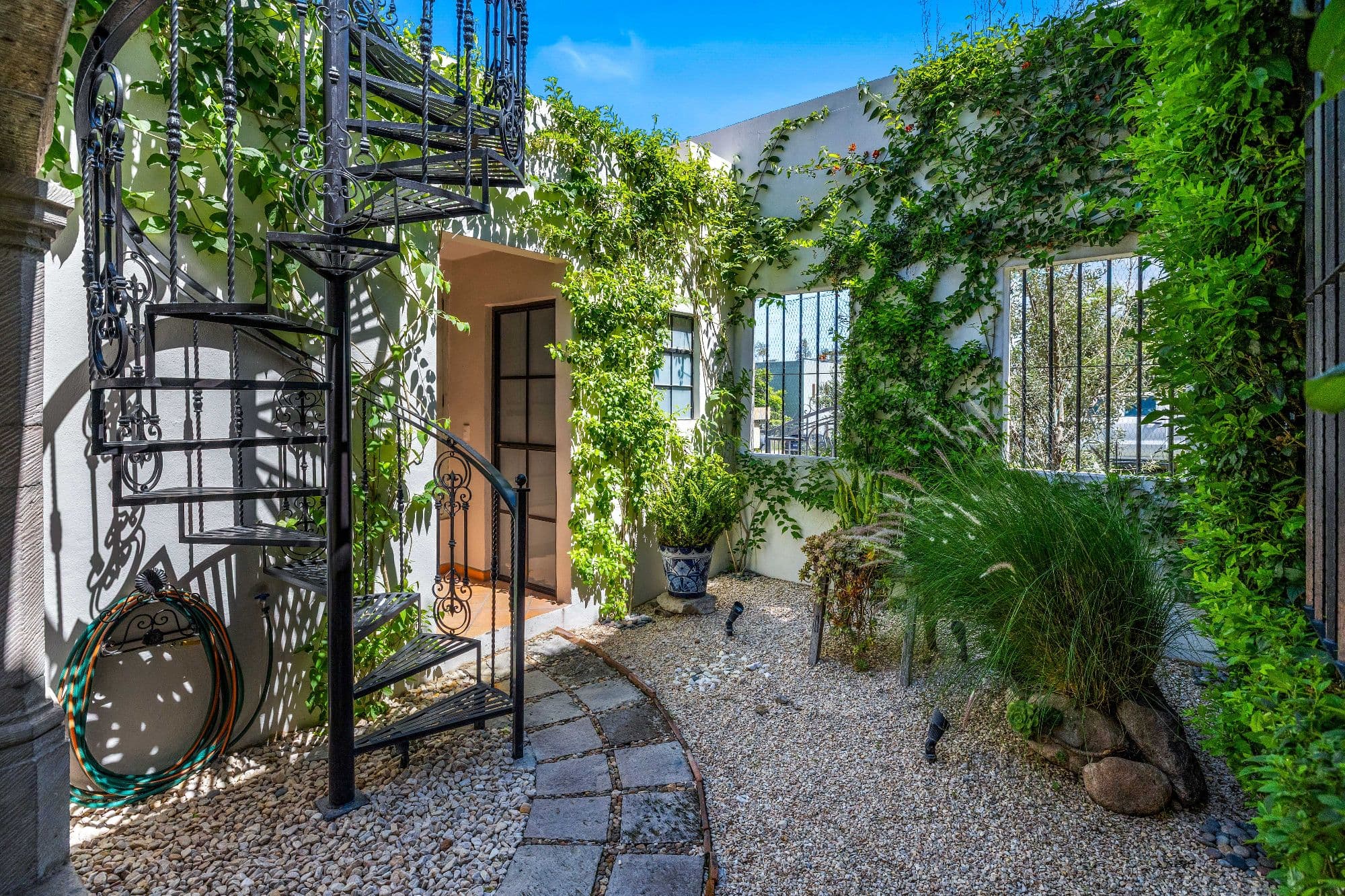 Casa de Gracias — Centro, San Miguel de Allende — photo 18 — lush courtyard, artisan metalwork elegance
