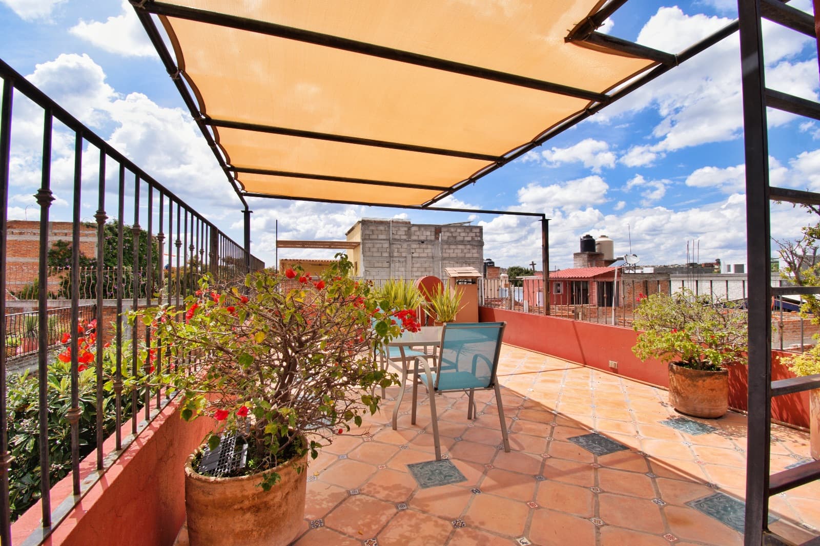 Casa Colores — Guadalupe, San Miguel de Allende — photo 8 — expansive rooftop terrace with panoramic city views