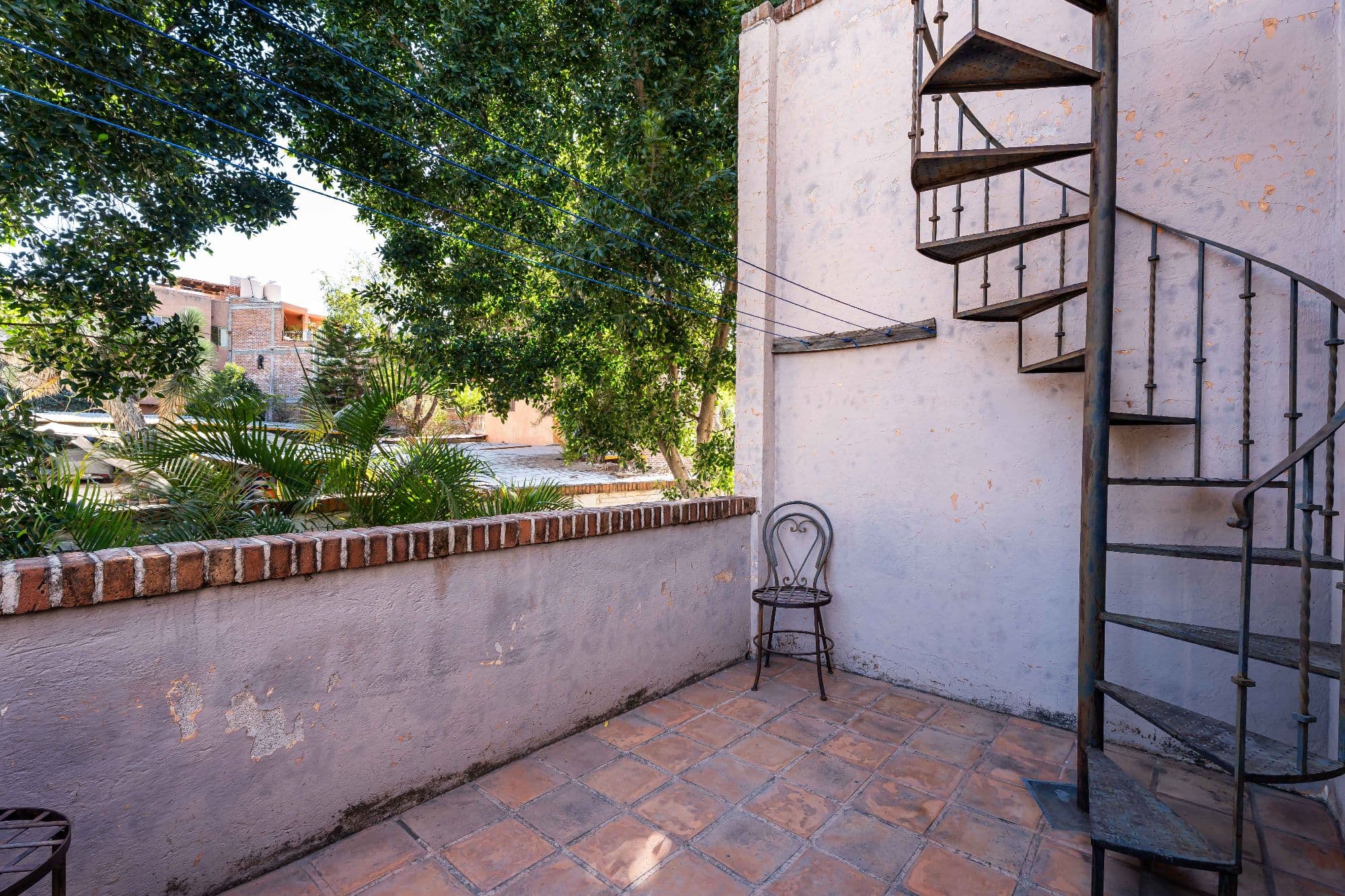 Casa Hidden Nook — San Antonio, San Miguel de Allende — photo 29 — charming courtyard with spiral staircase