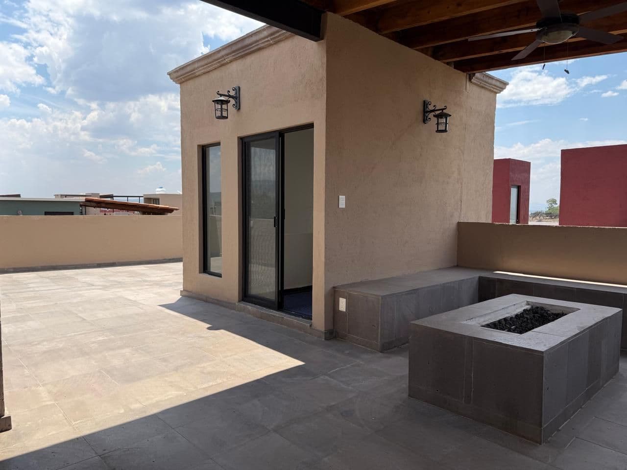 Vistas Del Capricho — El Capricho, San Miguel de Allende — photo 21 — expansive rooftop terrace with firepit