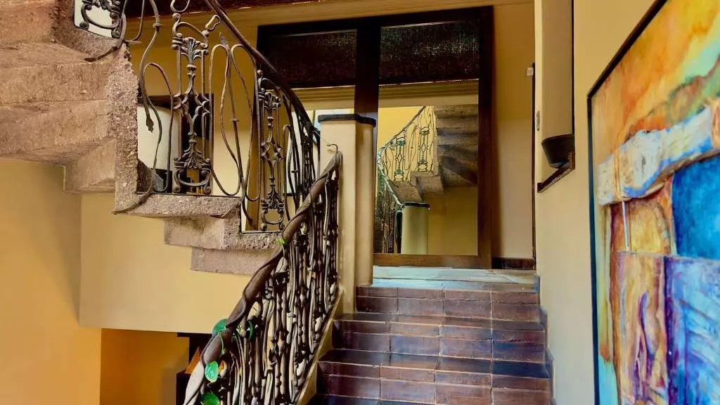 La Raiz De Las Nubes Los Balcones — Balcones, San Miguel de Allende — photo 13 — artfully curated staircase with ornate railings