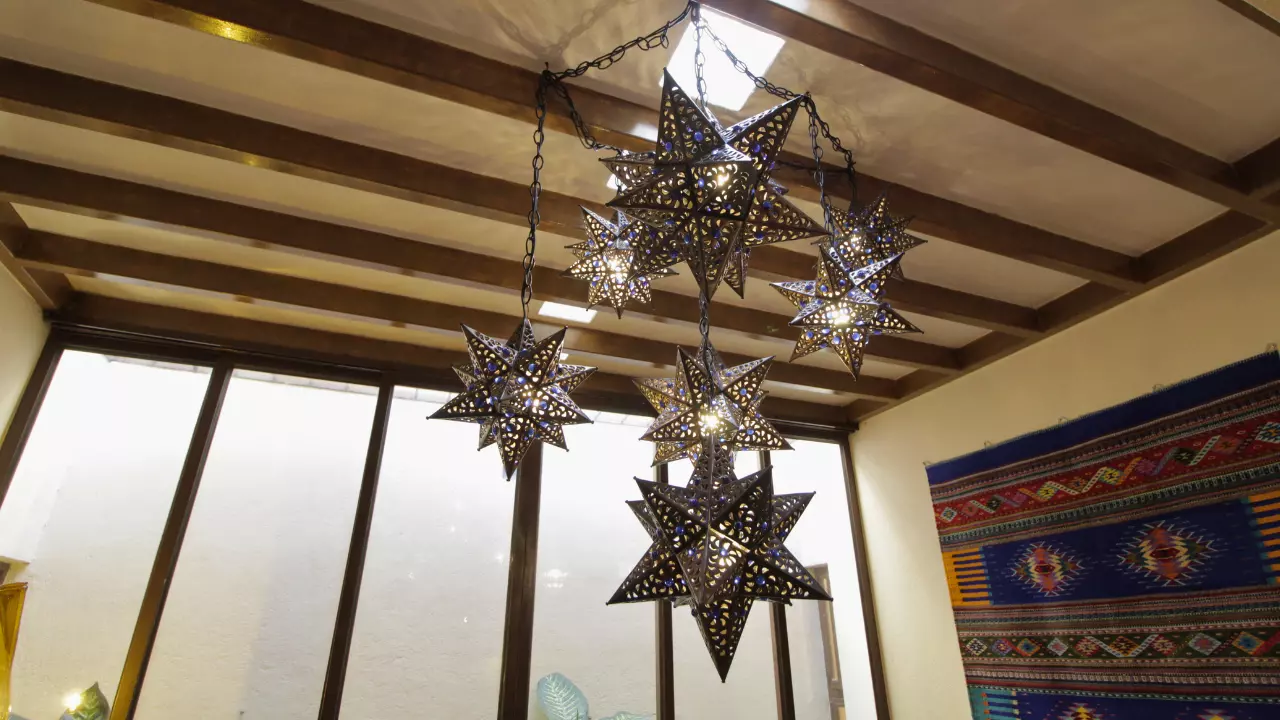Casa San Antonio — San Antonio, San Miguel de Allende — photo 13 — artisan star lanterns, rustic beam ceilings