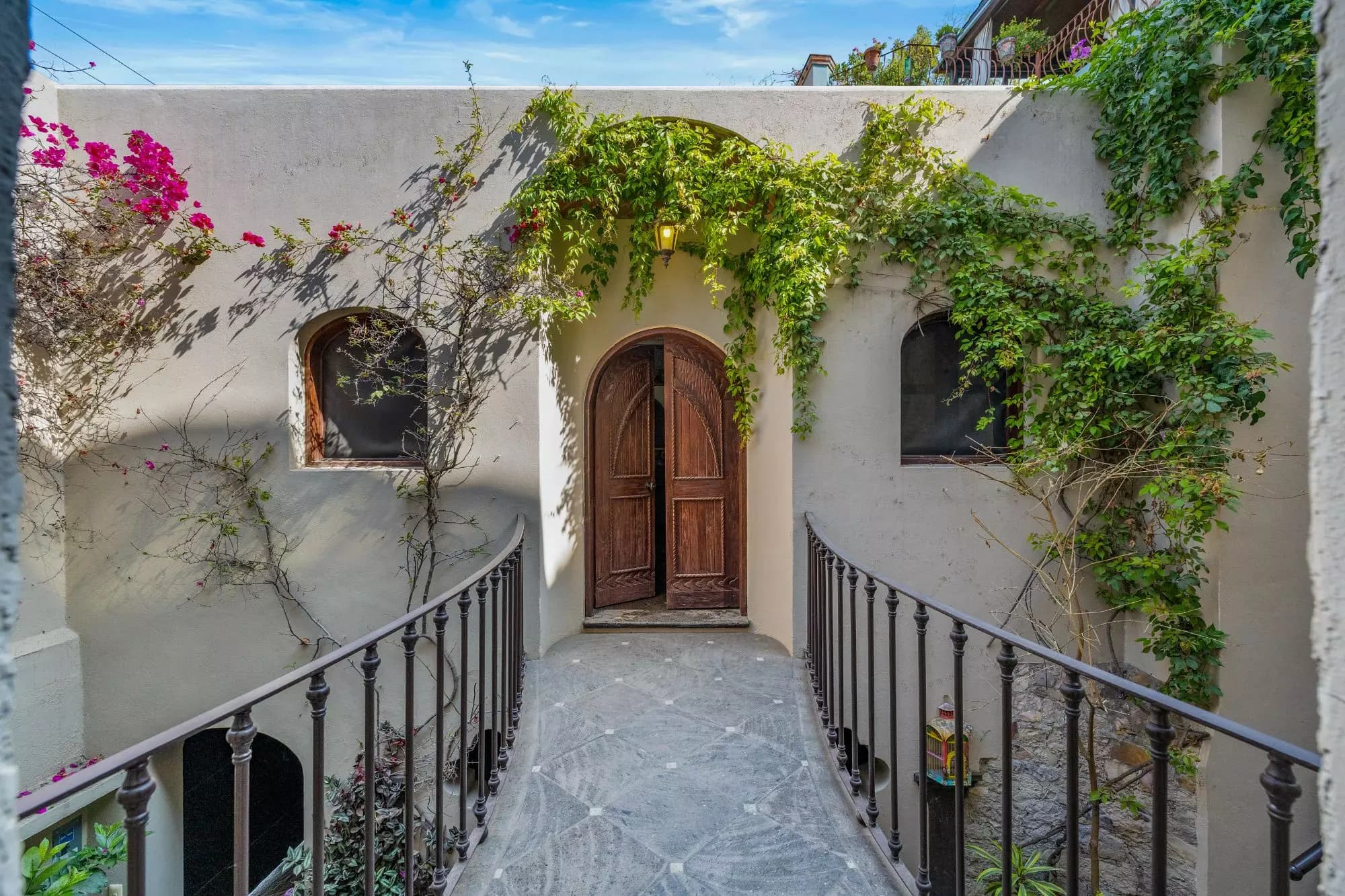 Casa Del Obraje — El Obraje, San Miguel de Allende — photo 27 — charming courtyard, vibrant bougainvillea abundance