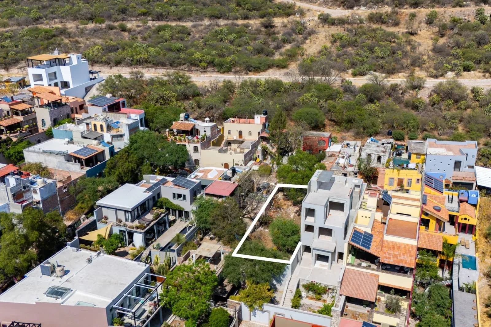 EL OBRAJE LOT — El Obraje, San Miguel de Allende — photo 10 — vibrant hillside community with architectural character
