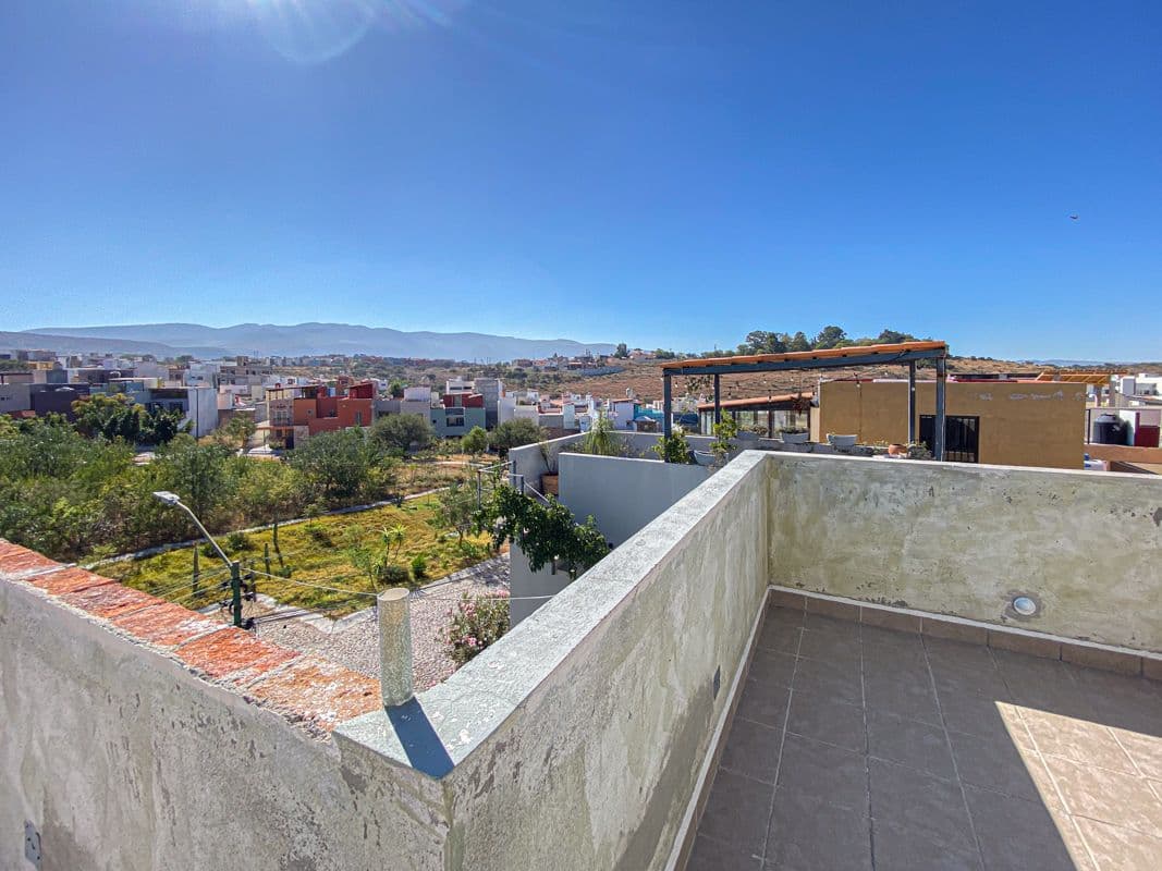 Casa Laura — Las Brisas, San Miguel de Allende — photo 23 — expansive rooftop terrace, panoramic mountain views